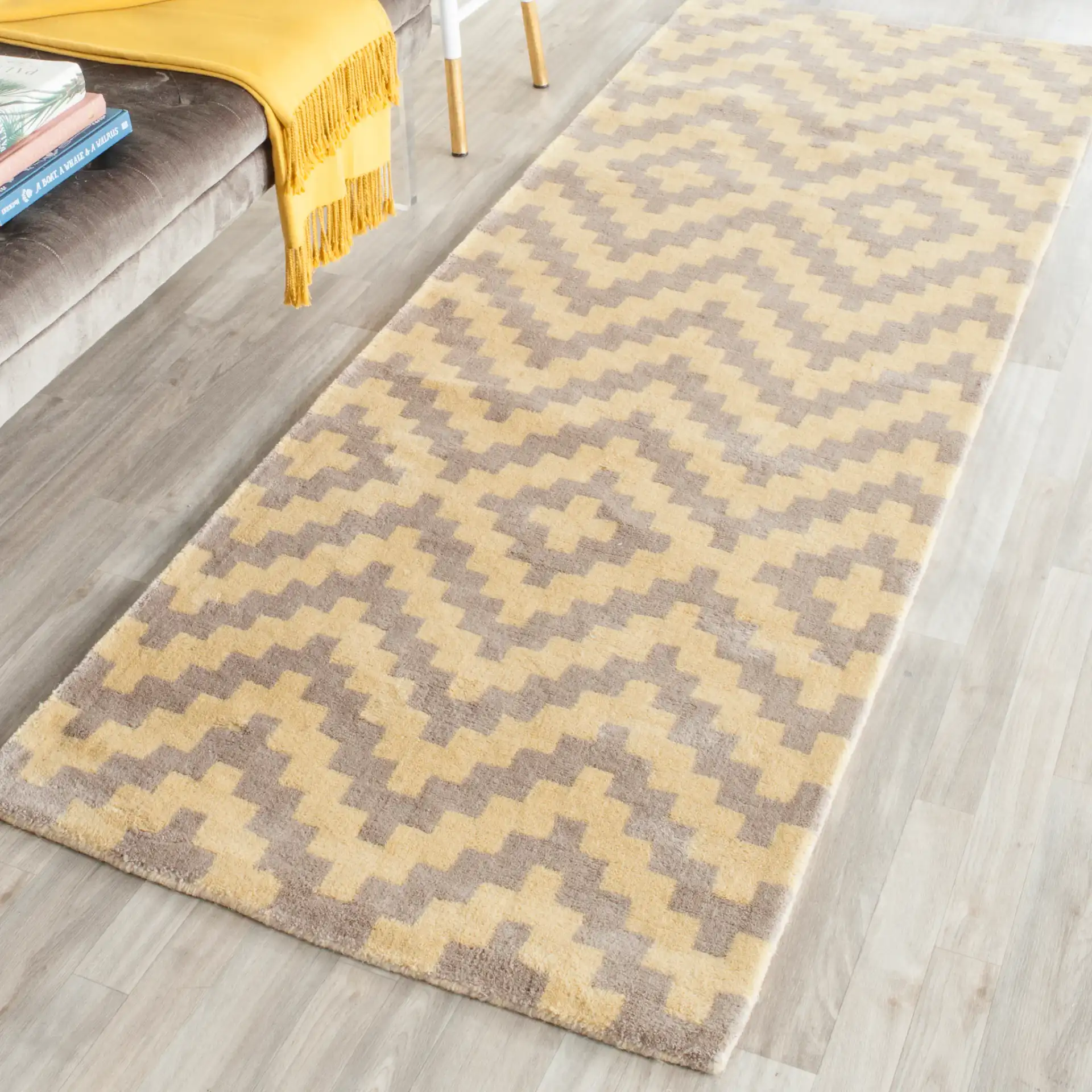 Cambridge Stepped Chevron Hand-Tufted Wool Rug in Taupe / Gold in a styled room