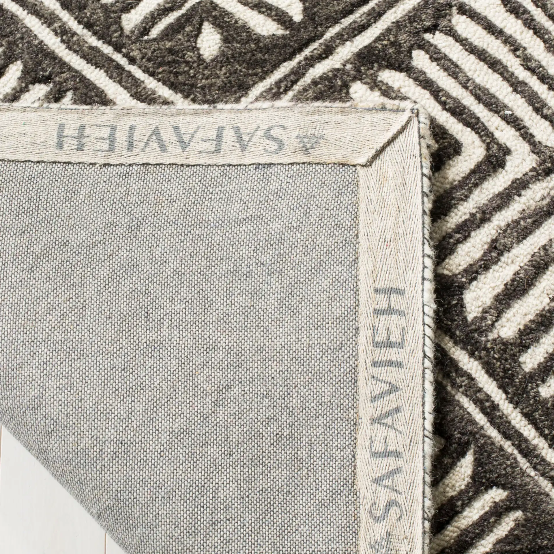 Cambridge Diamond Grid Hand-Tufted Wool Rug in Ivory / Charcoal in a styled room