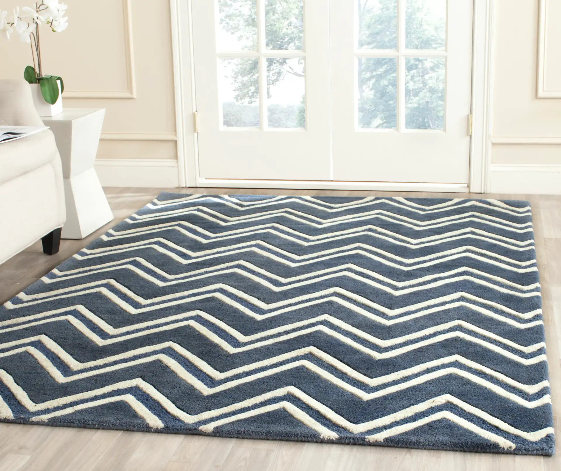 Cambridge Double Chevron Hand-Tufted Wool Rug in Navy / Ivory in a styled room