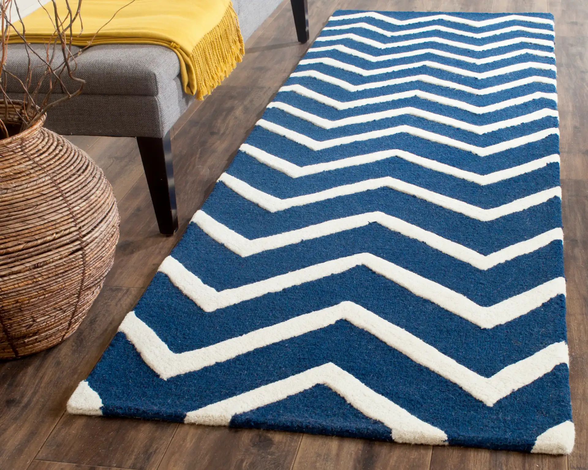 Cambridge Textured Chevron Hand-Tufted Wool Rug in Navy / Ivory in a styled room