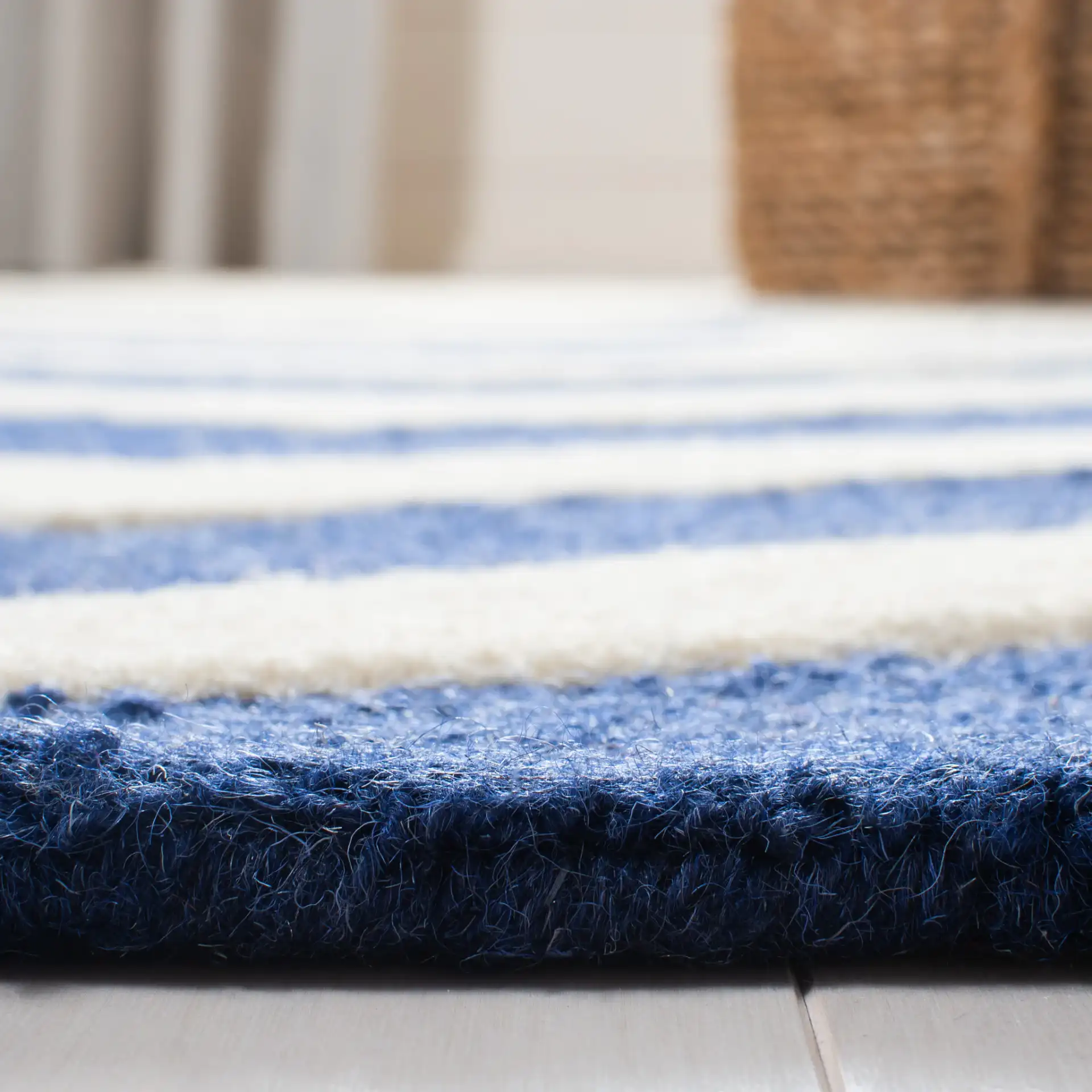 Cambridge Textured Chevron Hand-Tufted Wool Rug in Navy / Ivory in a styled room