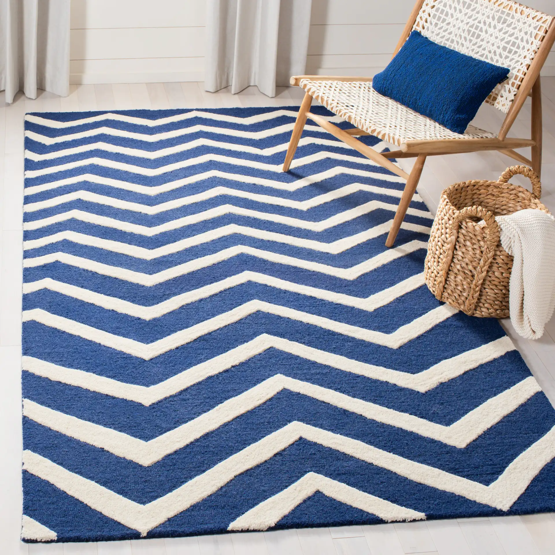 Cambridge Textured Chevron Hand-Tufted Wool Rug in Navy / Ivory in a styled room