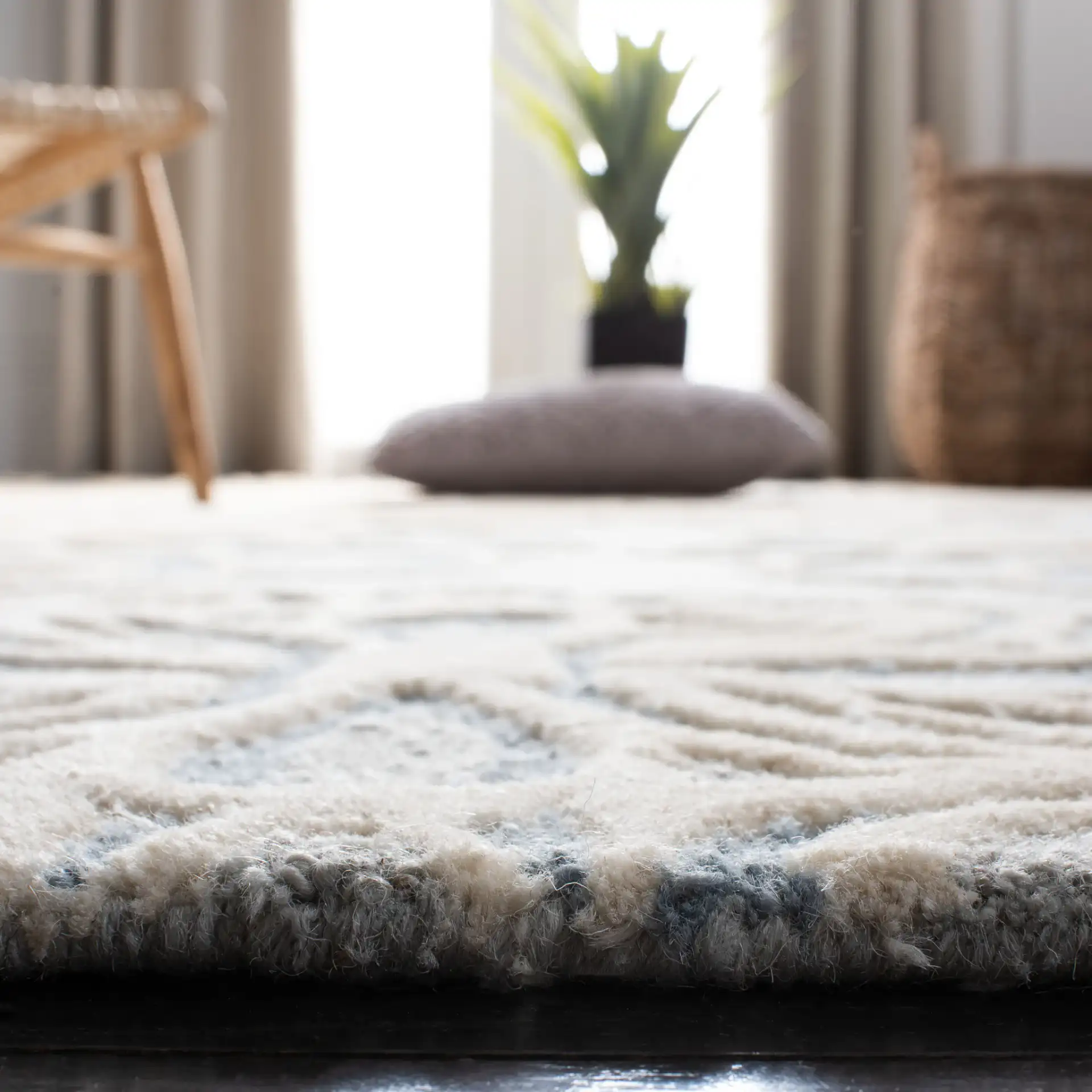 Cambridge Floral Medallion Hand-Tufted Wool Rug in Gray / Blue in a styled room