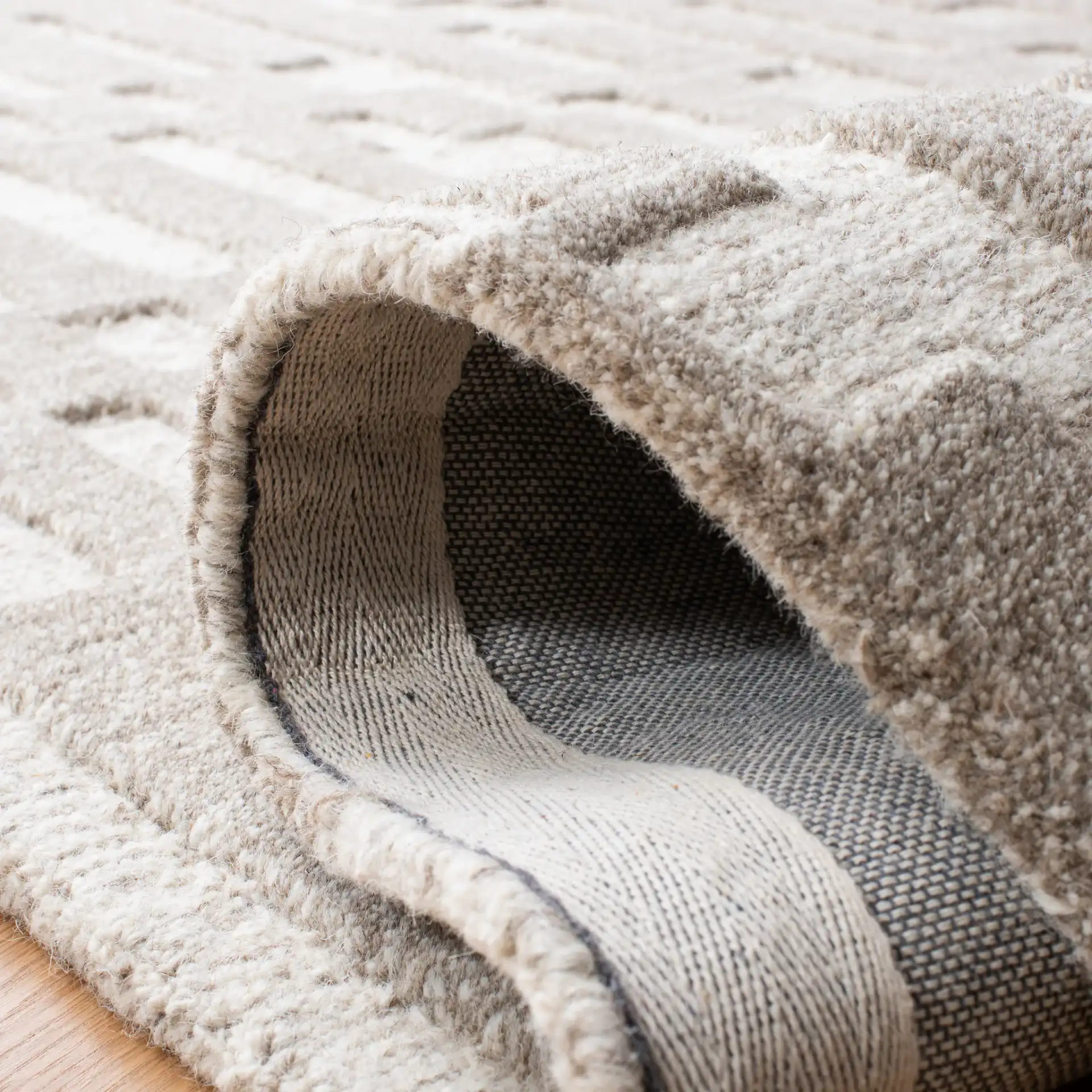 Cambridge Stepped Block Hand-Tufted Wool Rug in Beige / Gray in a styled room