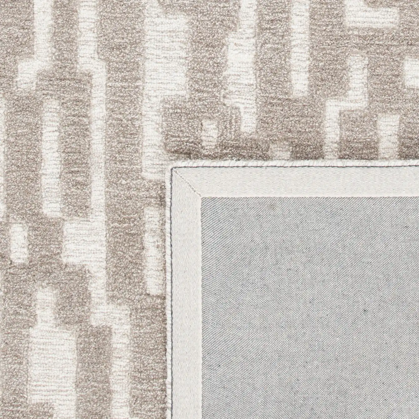 Cambridge Stepped Block Hand-Tufted Wool Rug in Beige / Gray in a styled room