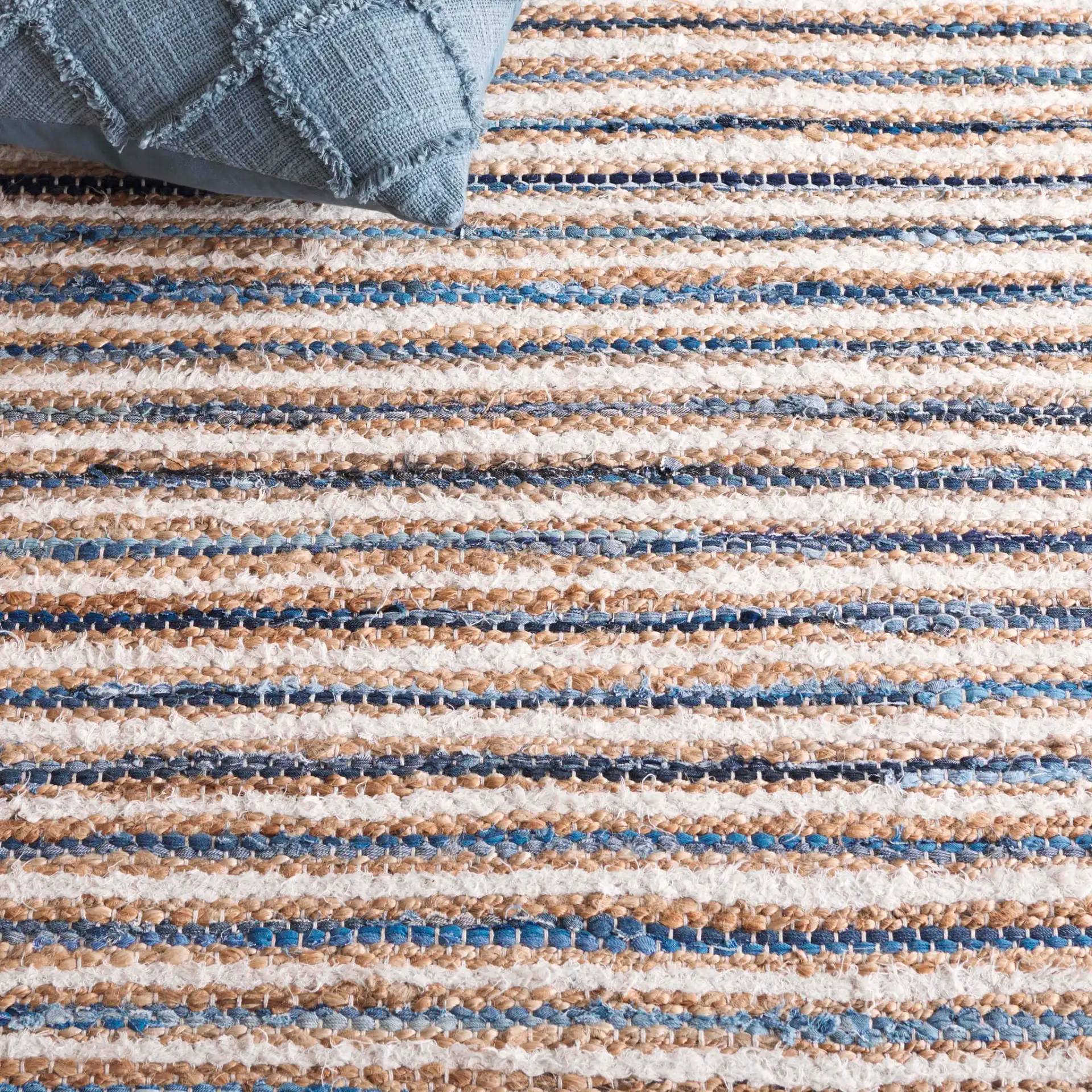 Cape Cod Fine Stripe Hand-Woven Rug in Natural / Blue in a styled room