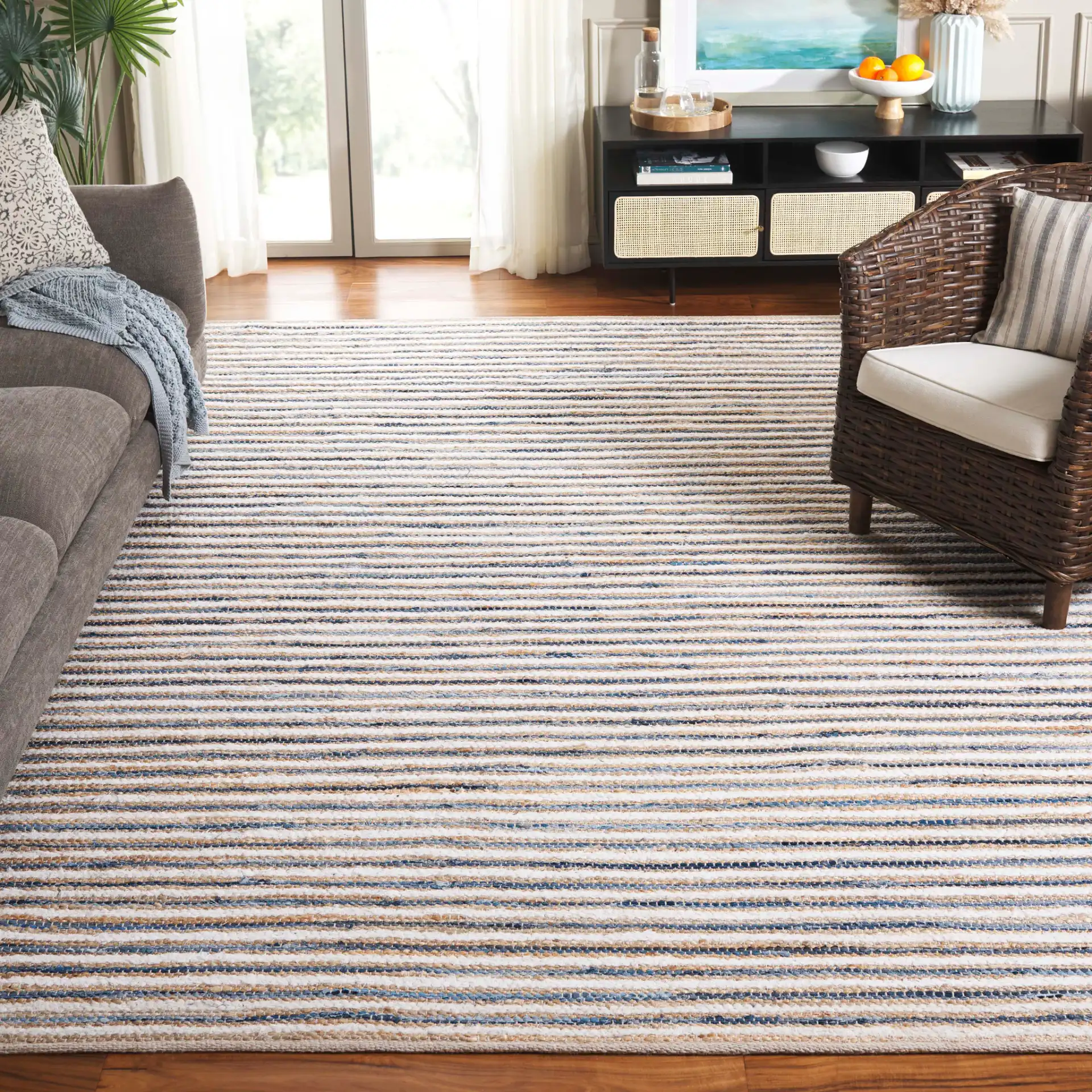 Cape Cod Fine Stripe Hand-Woven Rug in Natural / Blue in a styled room