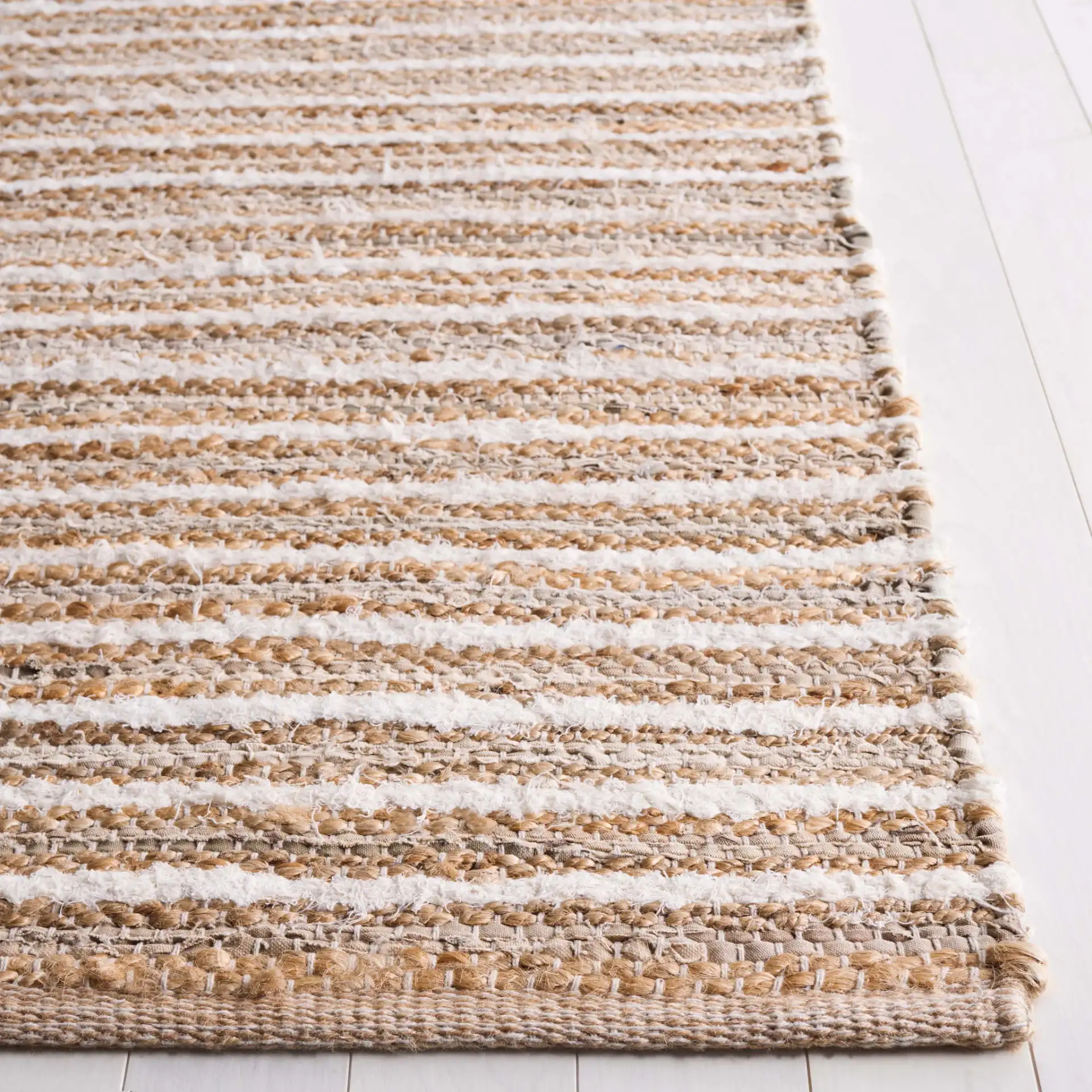 Cape Cod Linear Stripe Hand-Woven Rug in Natural / Beige in a styled room