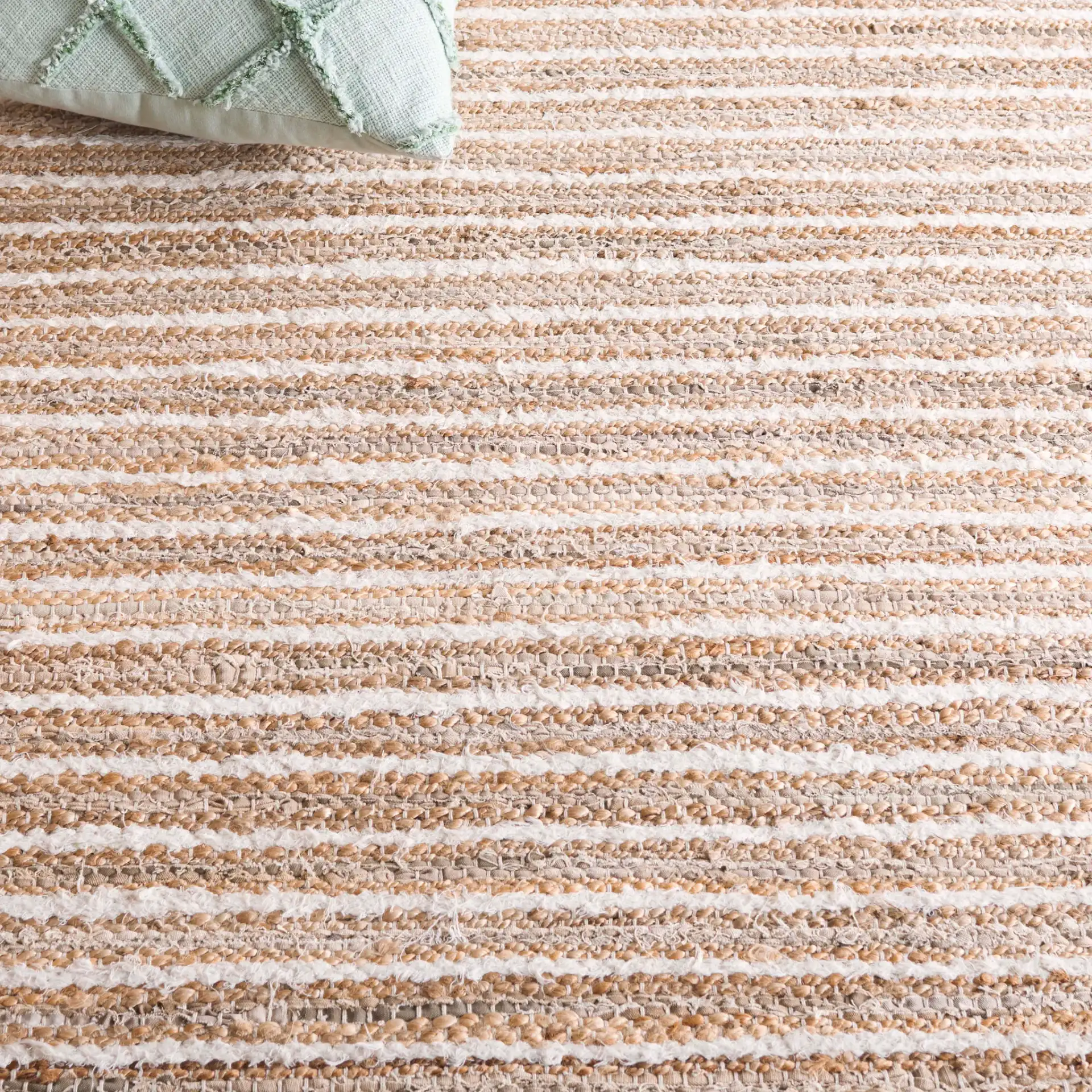 Cape Cod Linear Stripe Hand-Woven Rug in Natural / Beige in a styled room