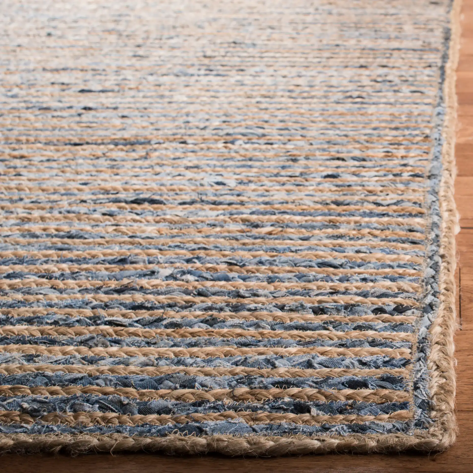 Cape Cod Braided Stripe Hand-Woven Rug in Natural / Blue in a styled room