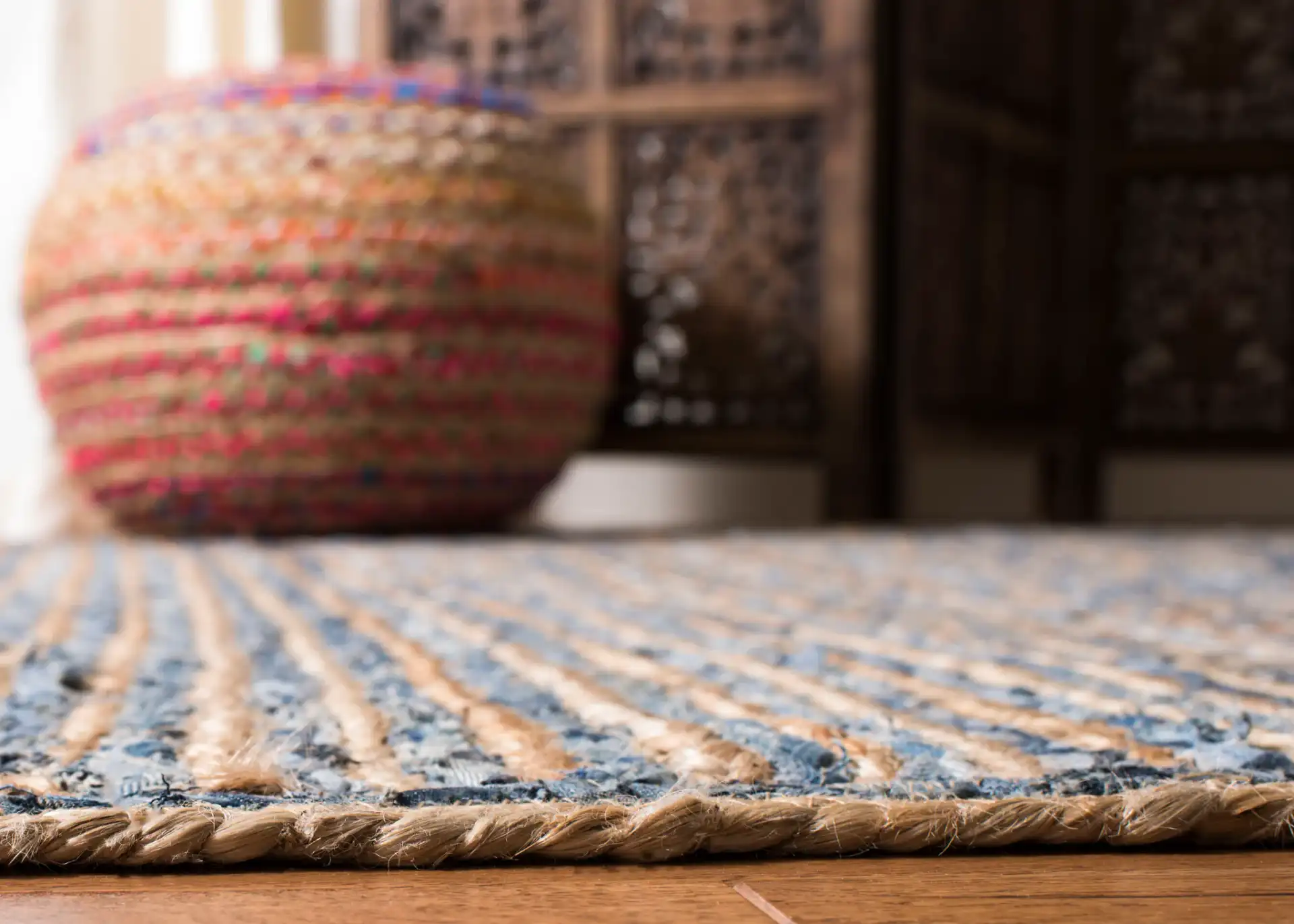 Cape Cod Braided Stripe Hand-Woven Rug in Natural / Blue in a styled room