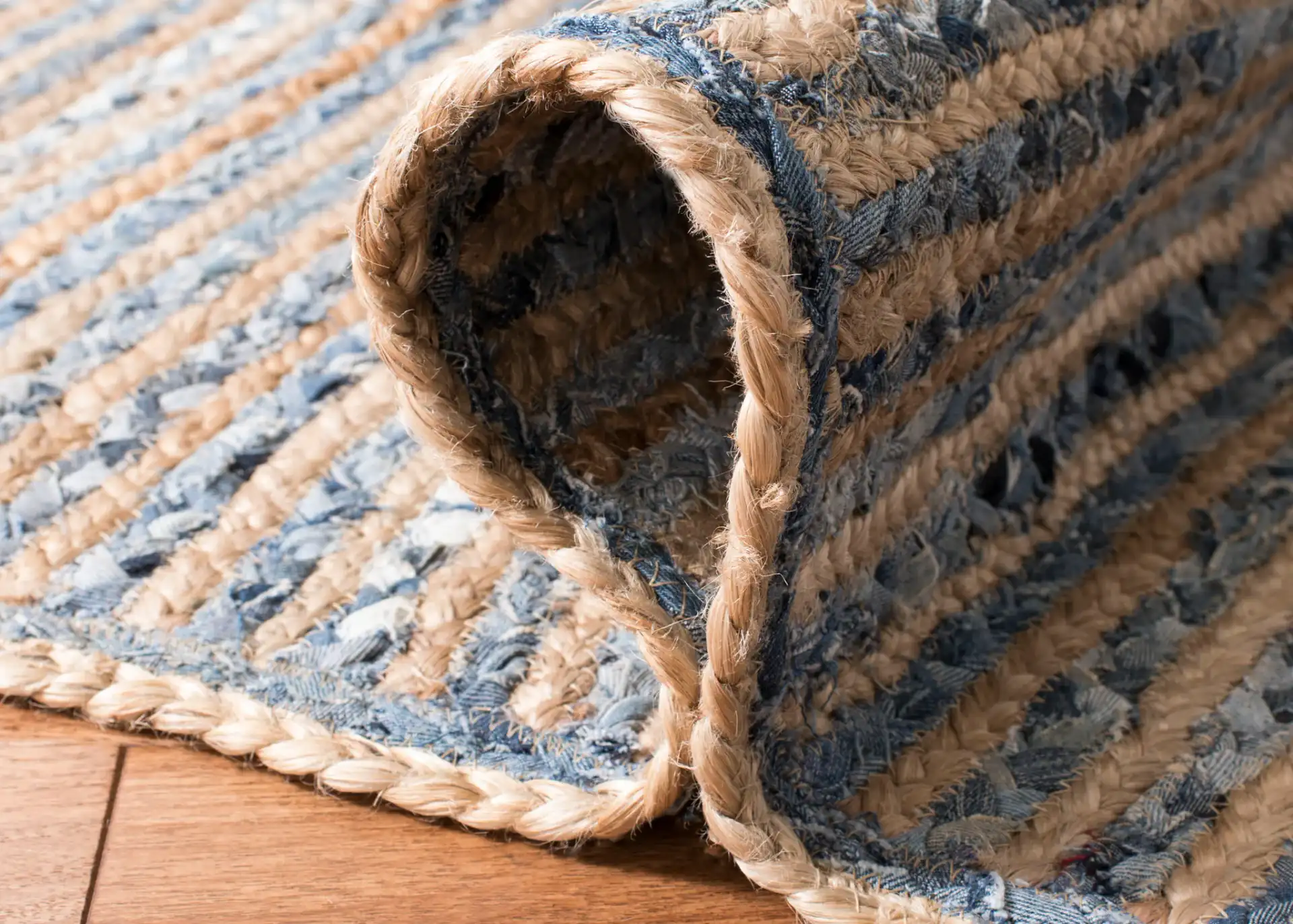 Cape Cod Braided Stripe Hand-Woven Rug in Natural / Blue in a styled room