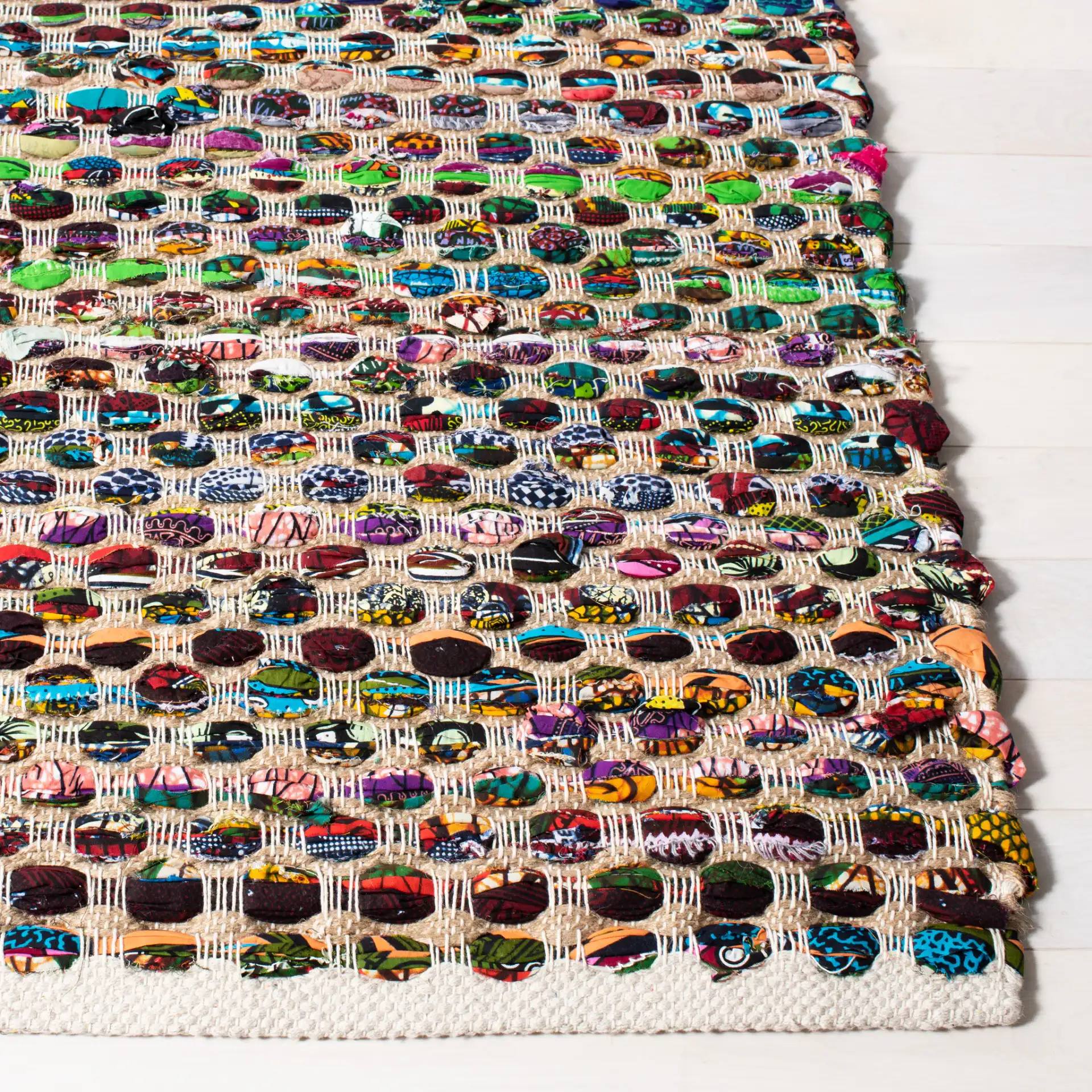 Cape Cod Pebble Hand-Woven Jute Rug in Natural / Multicolor in a styled room