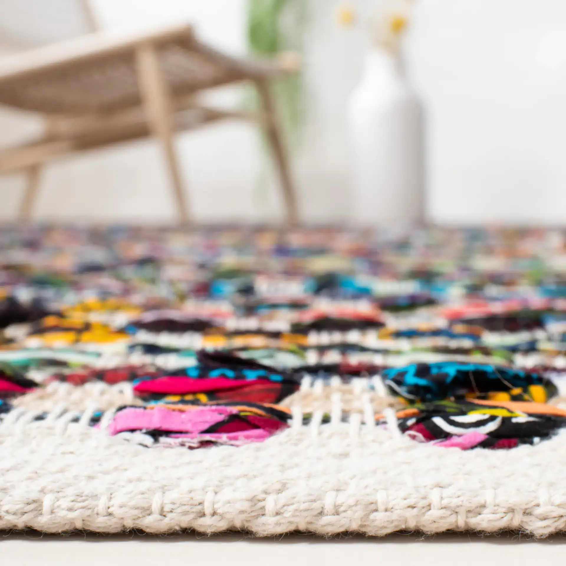 Cape Cod Pebble Hand-Woven Jute Rug in Natural / Multicolor in a styled room