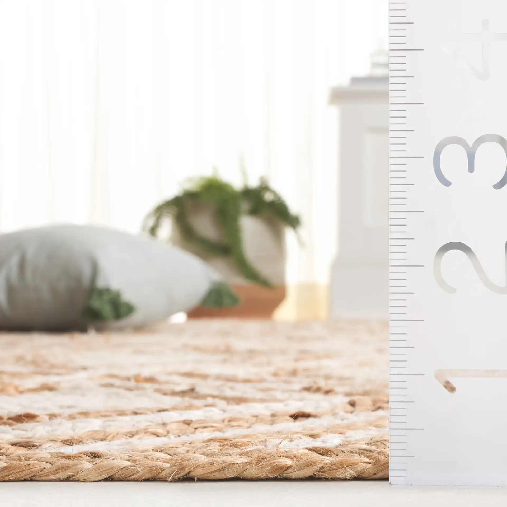Cape Cod Nested Diamond Hand-Woven Jute Rug in Natural / Ivory in a styled room