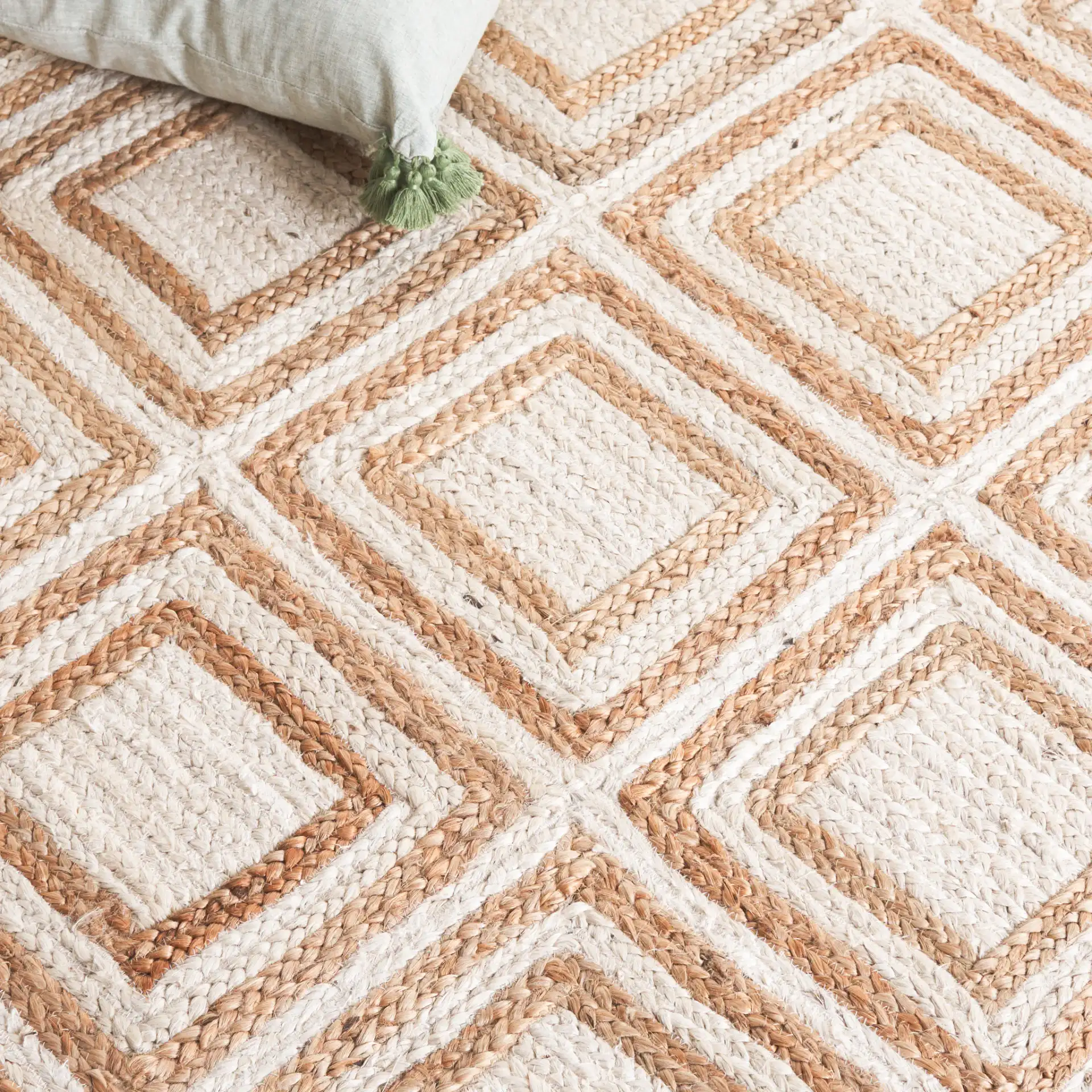 Cape Cod Nested Diamond Hand-Woven Jute Rug in Natural / Ivory in a styled room