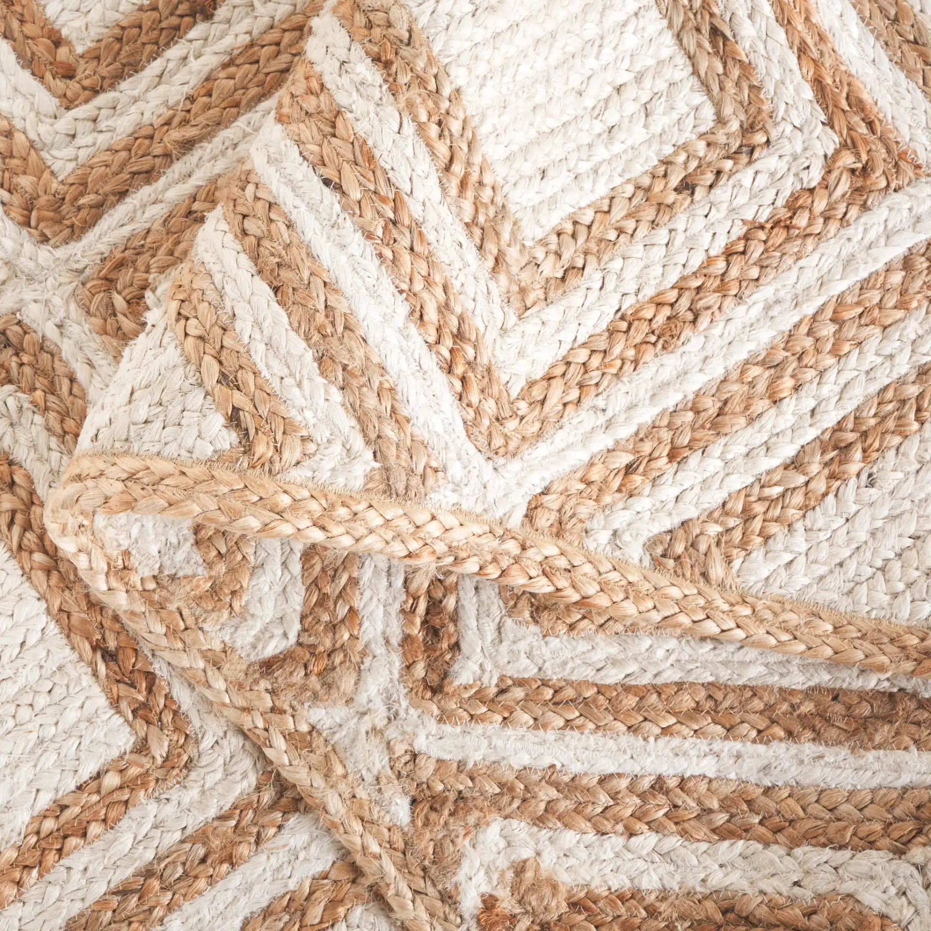 Cape Cod Nested Diamond Hand-Woven Jute Rug in Natural / Ivory in a styled room
