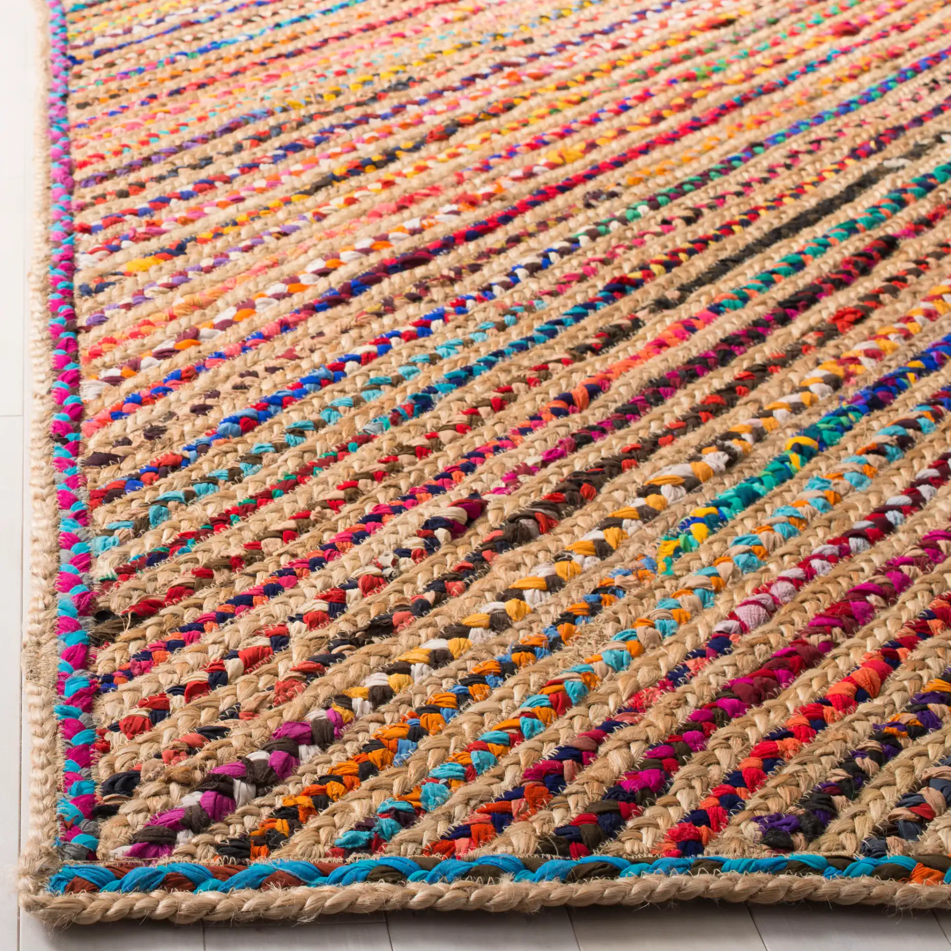Cape Cod Diagonal Stripe Hand-Woven Rug in Natural / Red in a styled room