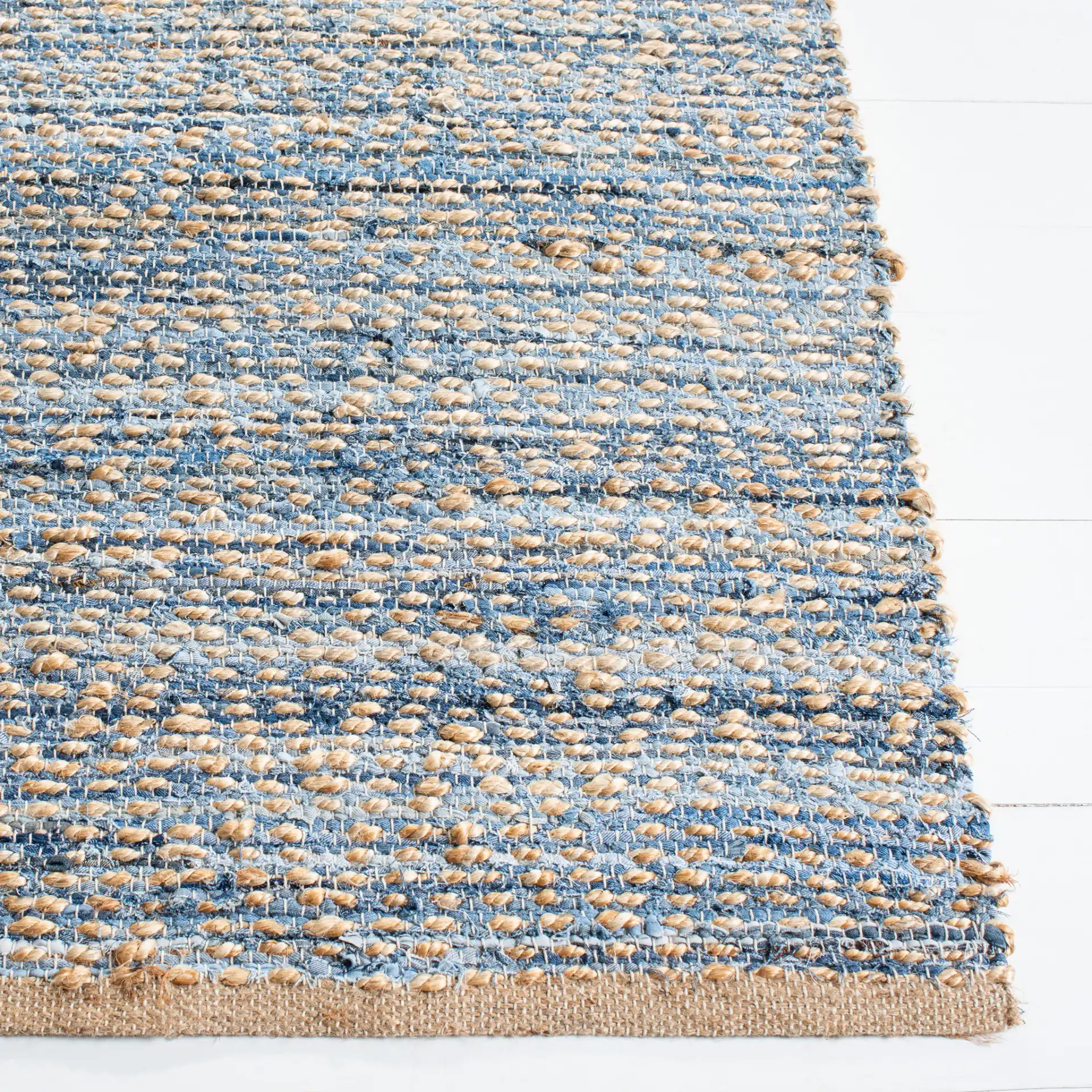 Cape Cod Striated Hand-Woven Rug in Natural / Blue in a styled room