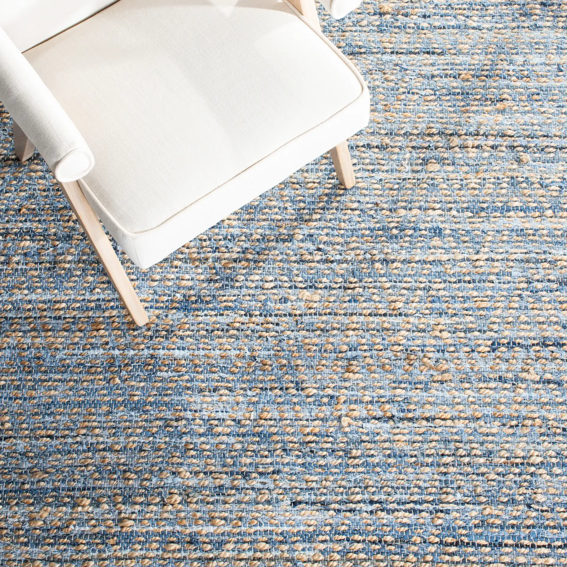 Cape Cod Striated Hand-Woven Rug in Natural / Blue in a styled room