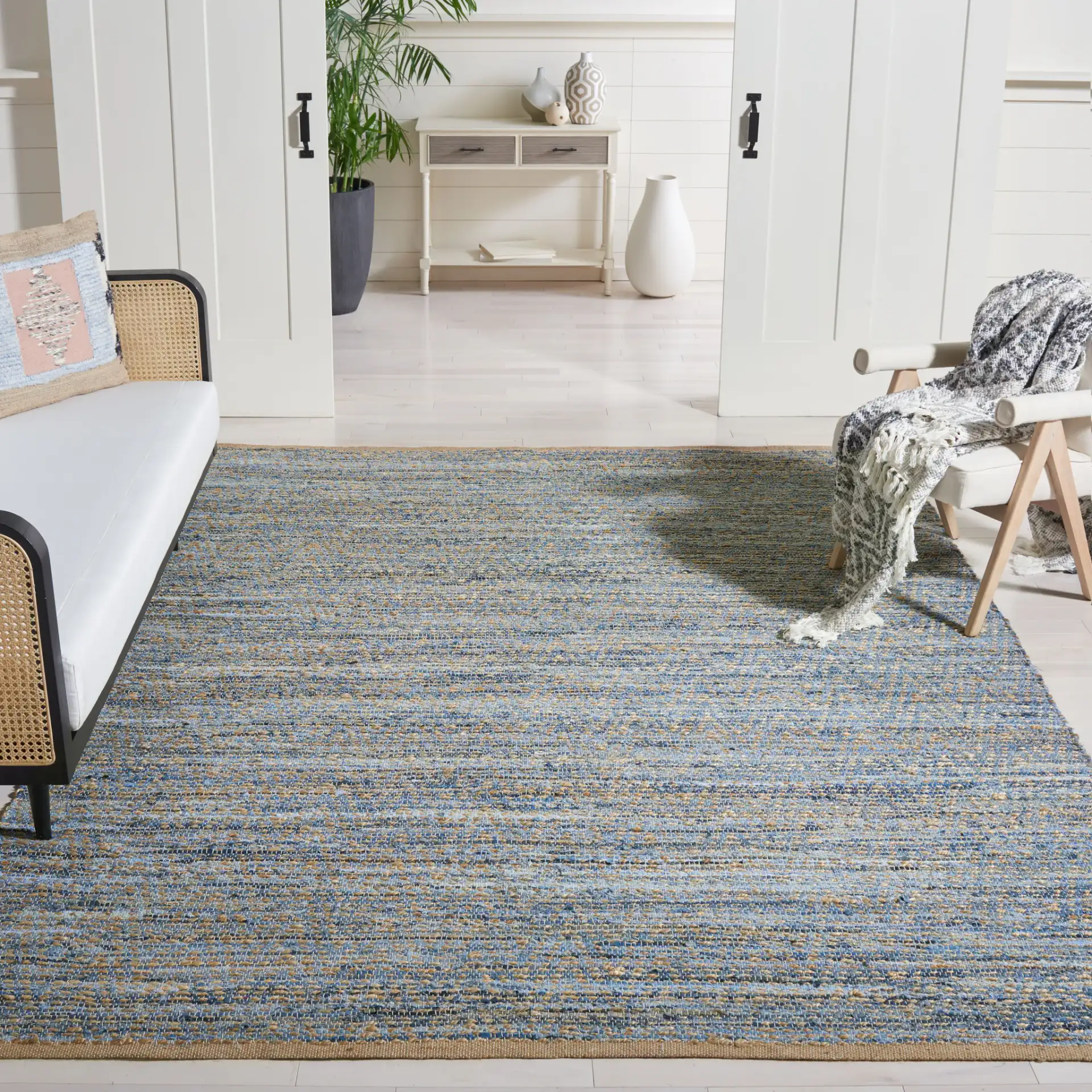 Cape Cod Striated Hand-Woven Rug in Natural / Blue in a styled room