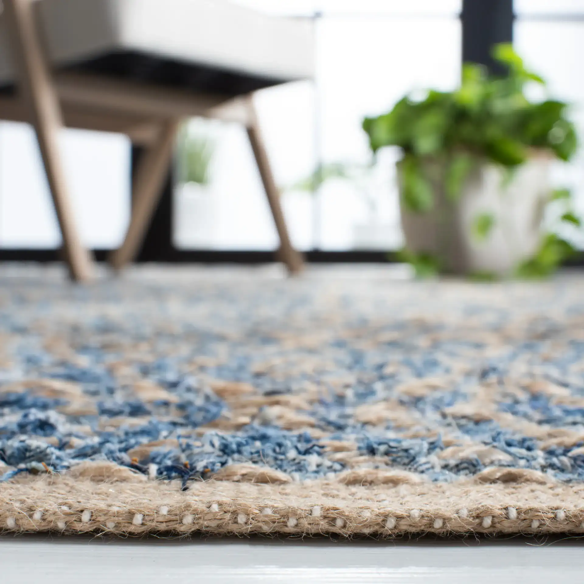 Cape Cod Heathered Stripe Hand-Woven Rug in Natural / Blue in a styled room