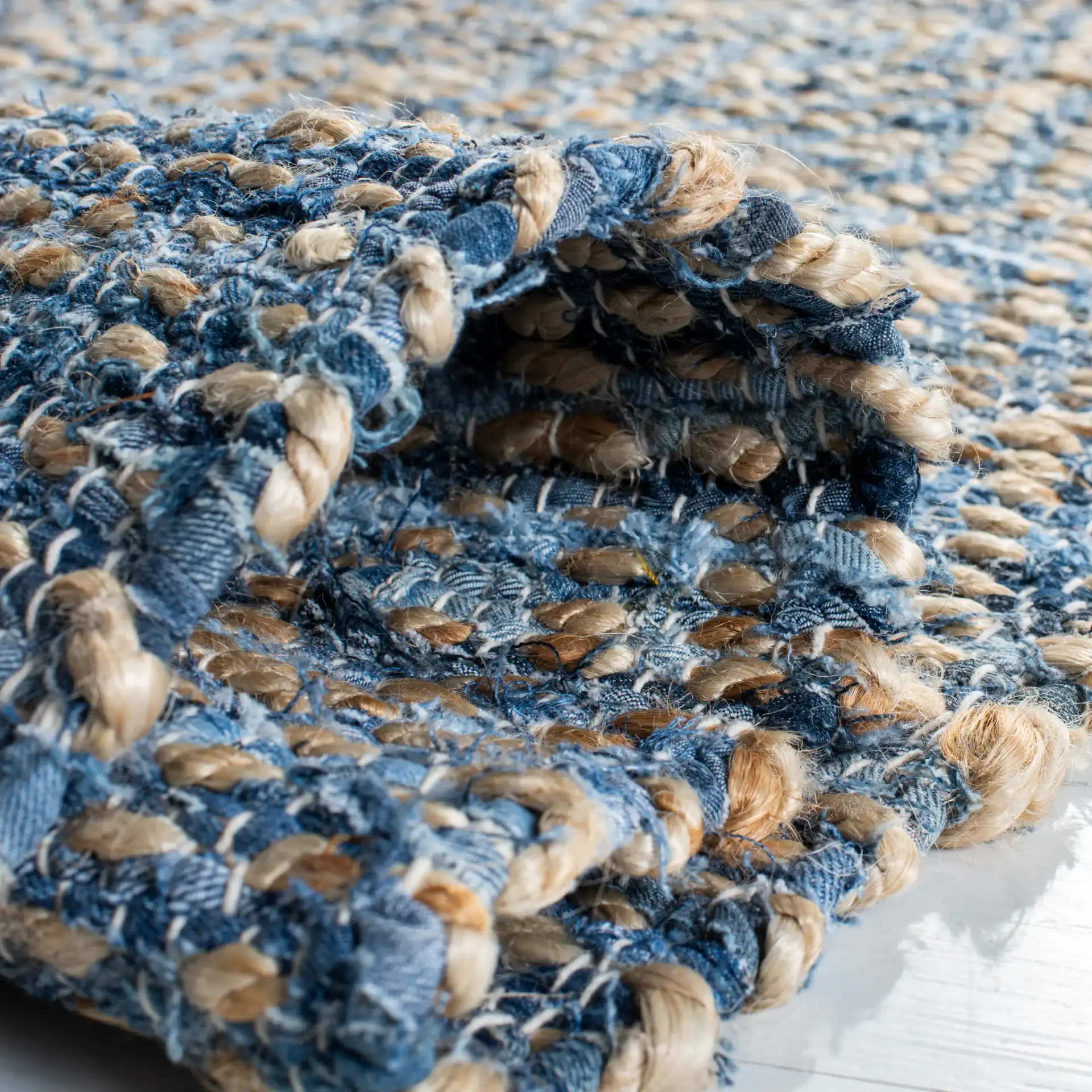 Cape Cod Heathered Stripe Hand-Woven Rug in Natural / Blue in a styled room