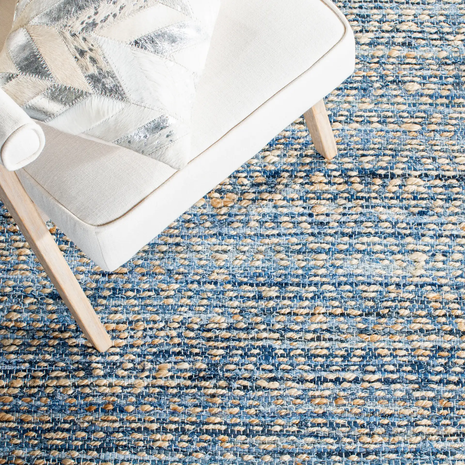 Cape Cod Heathered Stripe Hand-Woven Rug in Natural / Blue in a styled room