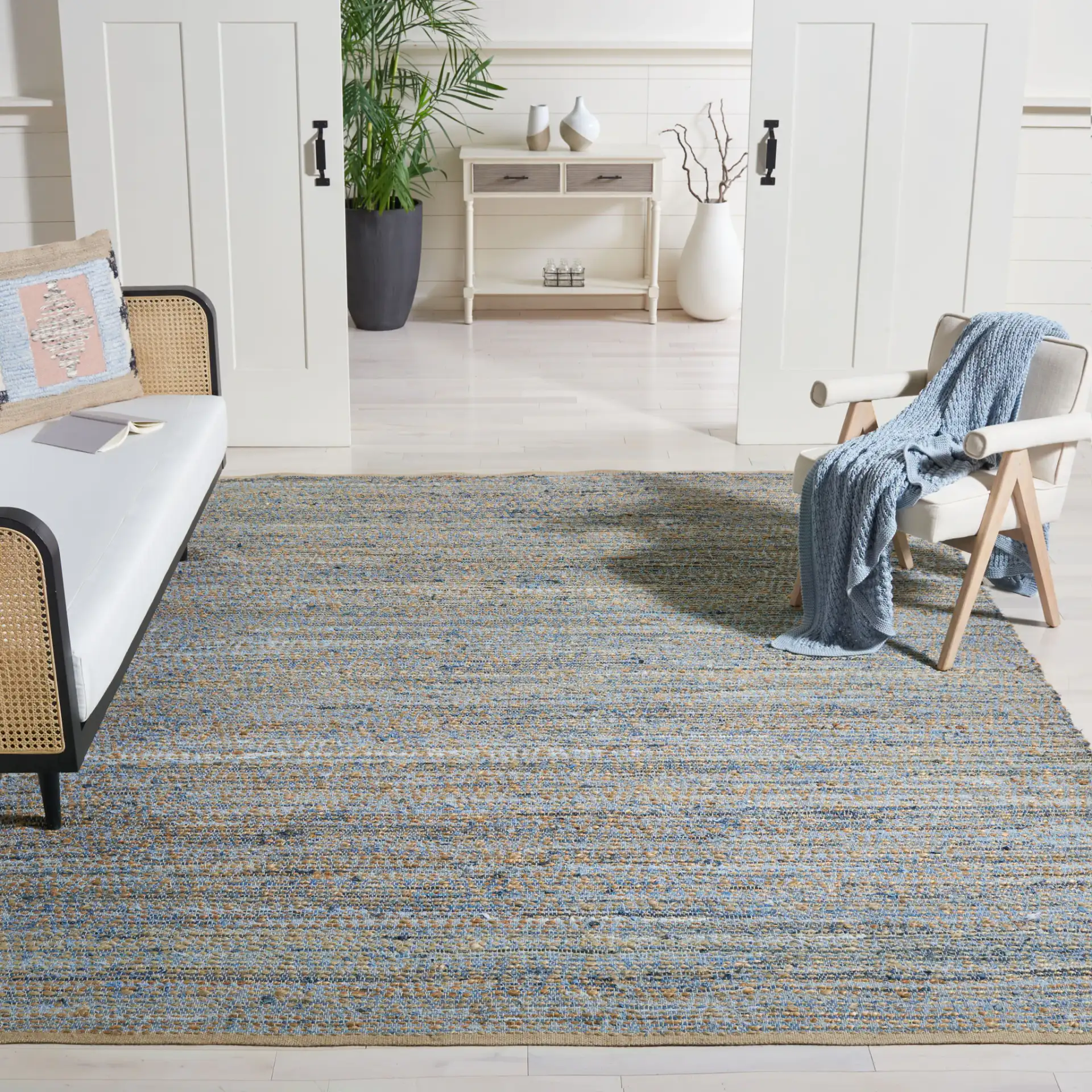 Cape Cod Heathered Stripe Hand-Woven Rug in Natural / Blue in a styled room