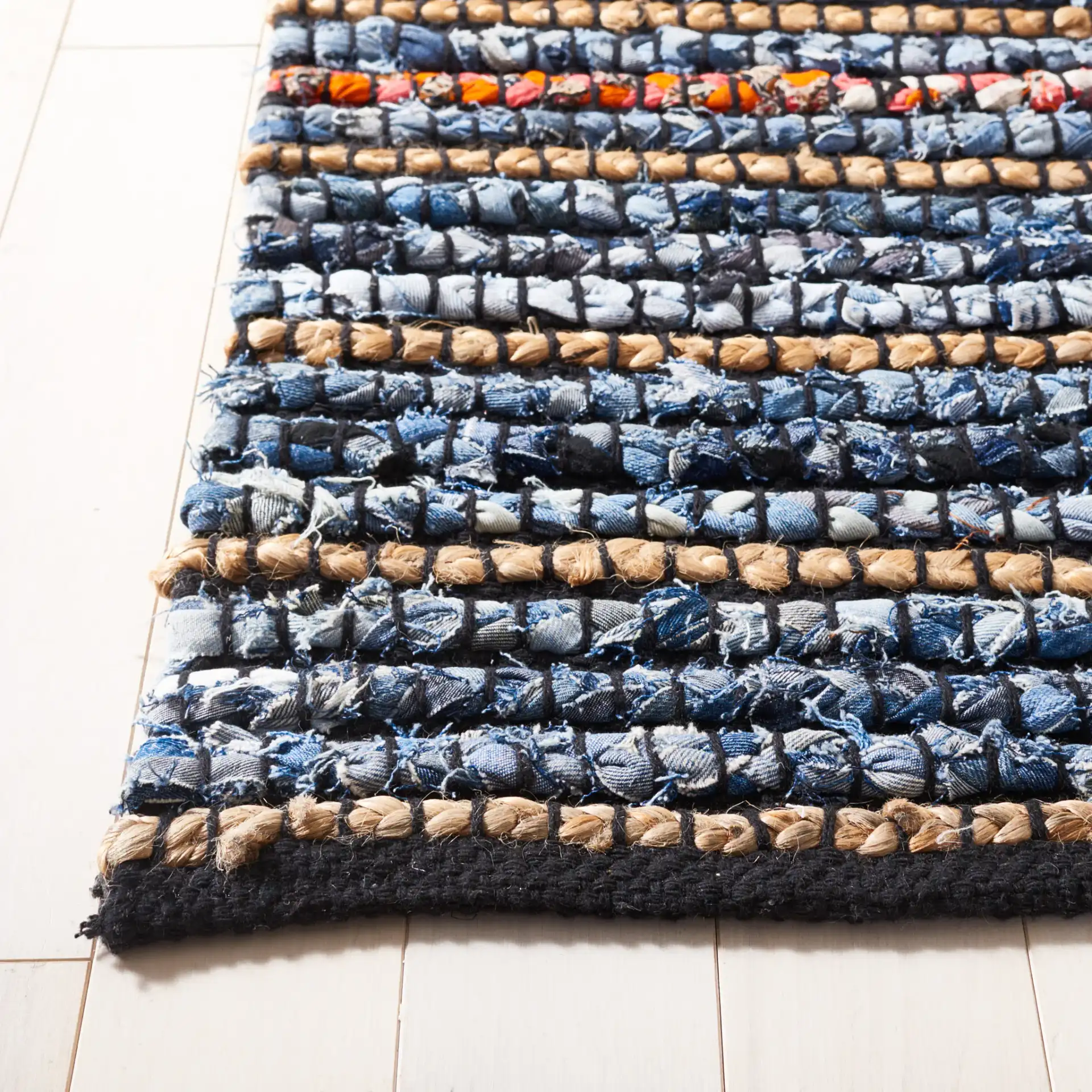 Cape Cod Allover Rag Stripe Hand-Woven Rug in Natural / Blue in a styled room