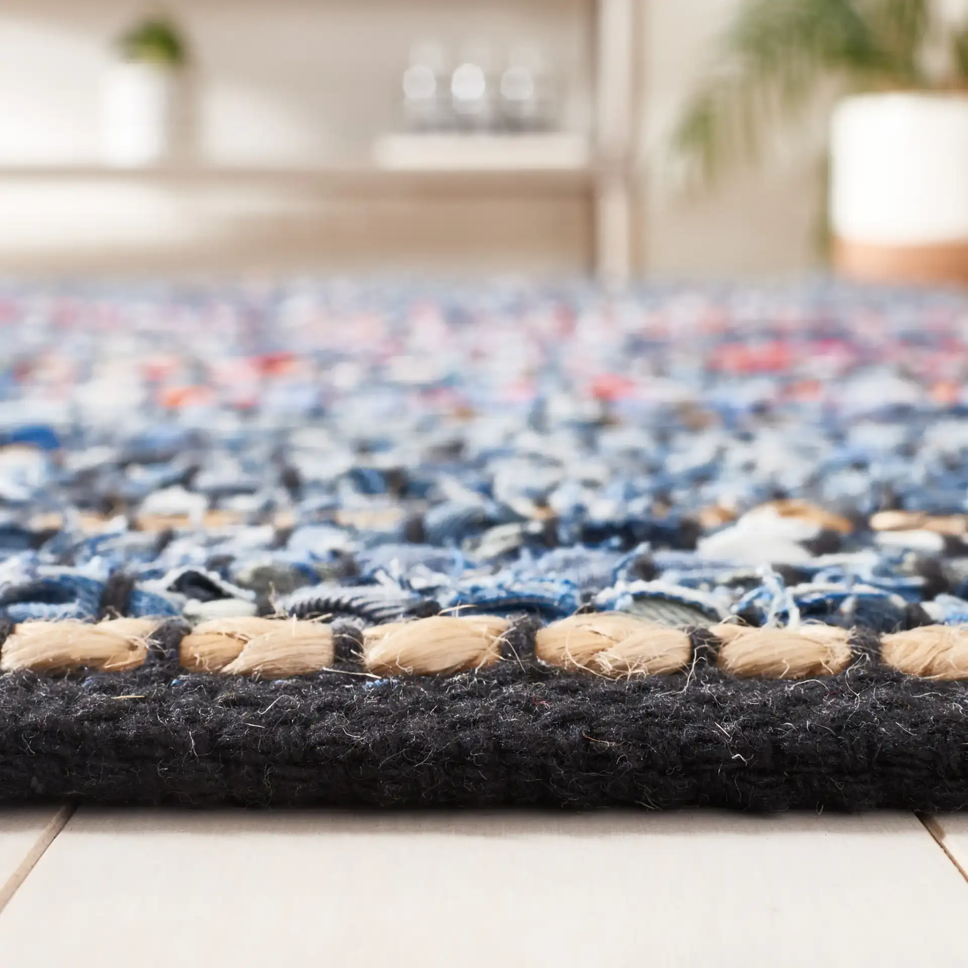Cape Cod Allover Rag Stripe Hand-Woven Rug in Natural / Blue in a styled room