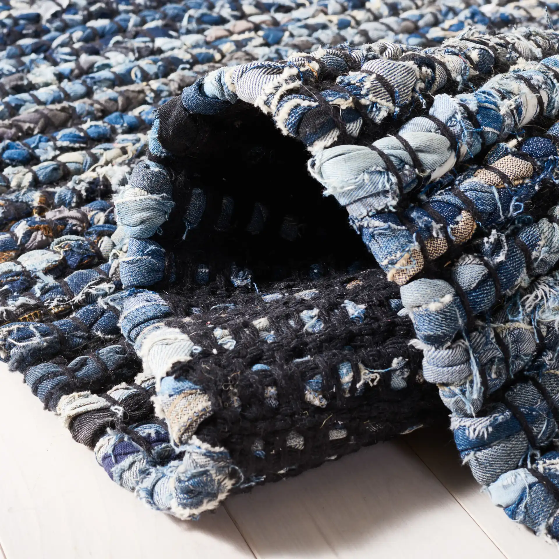Cape Cod Dual Border Stripe Hand-Woven Rug in Natural / Blue in a styled room