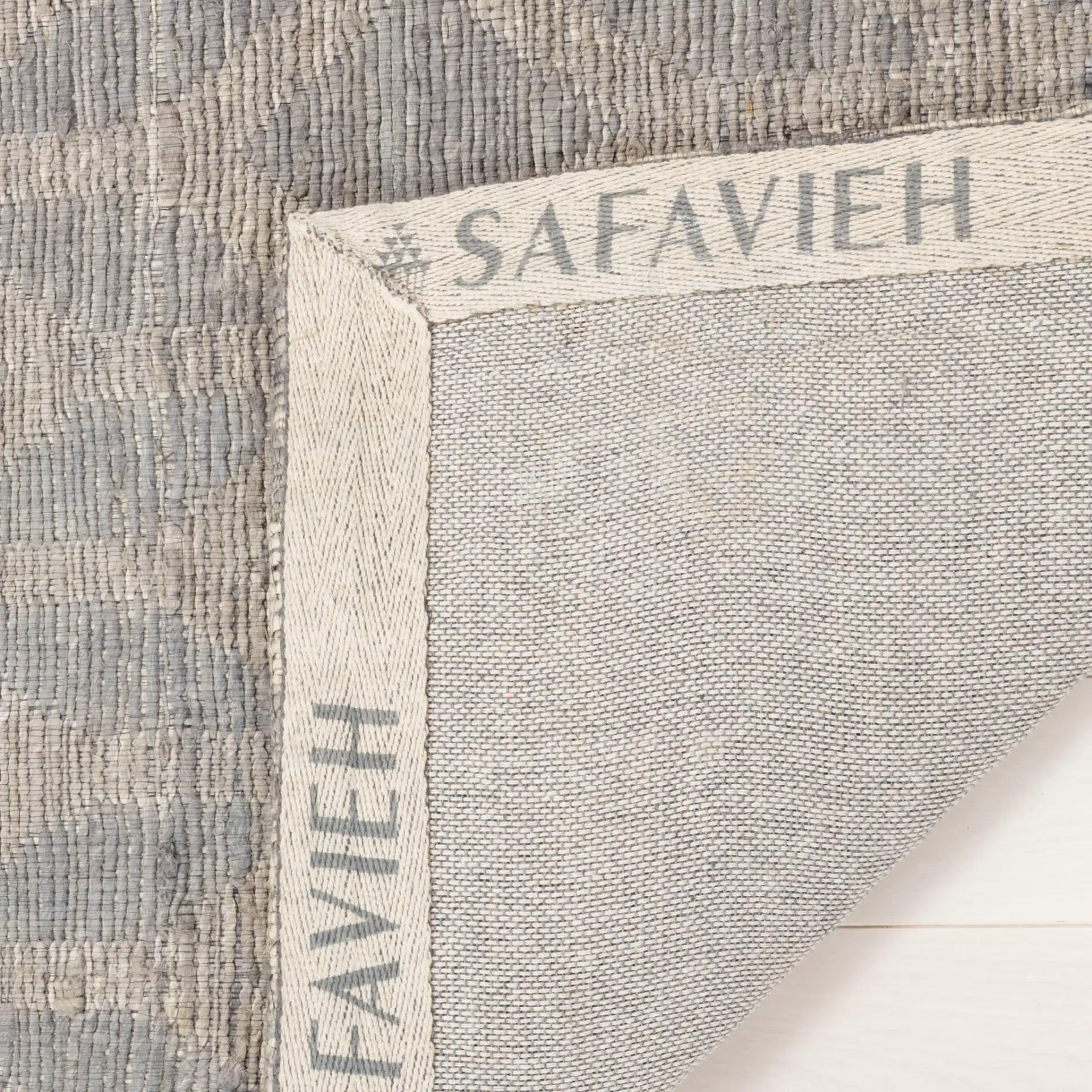 Cape Cod Diamond Hand-Woven Jute Rug in Gray / Gold in a styled room
