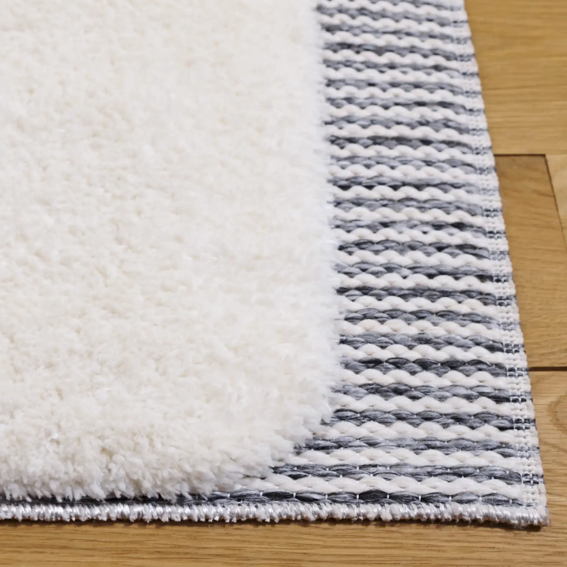 Celebrity Rounded Block Rug in Ivory / Gray in a styled room