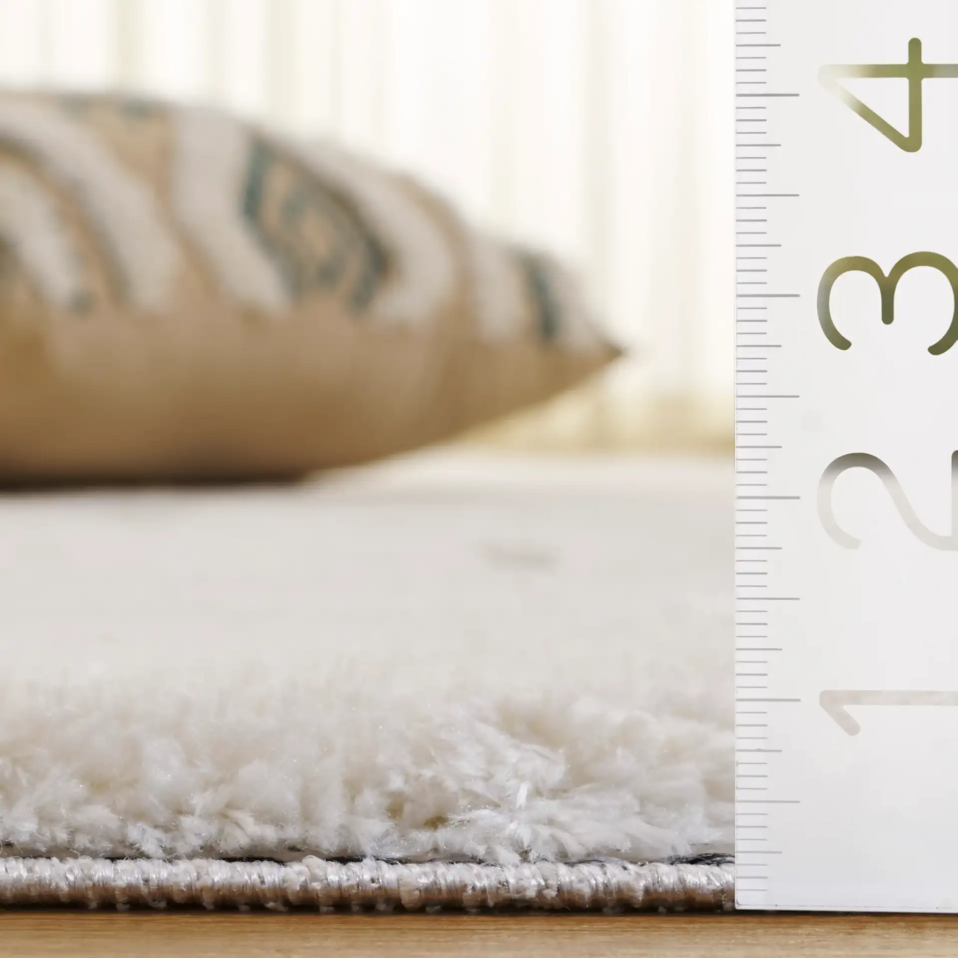 Celebrity Rounded Block Rug in Ivory / Gray in a styled room