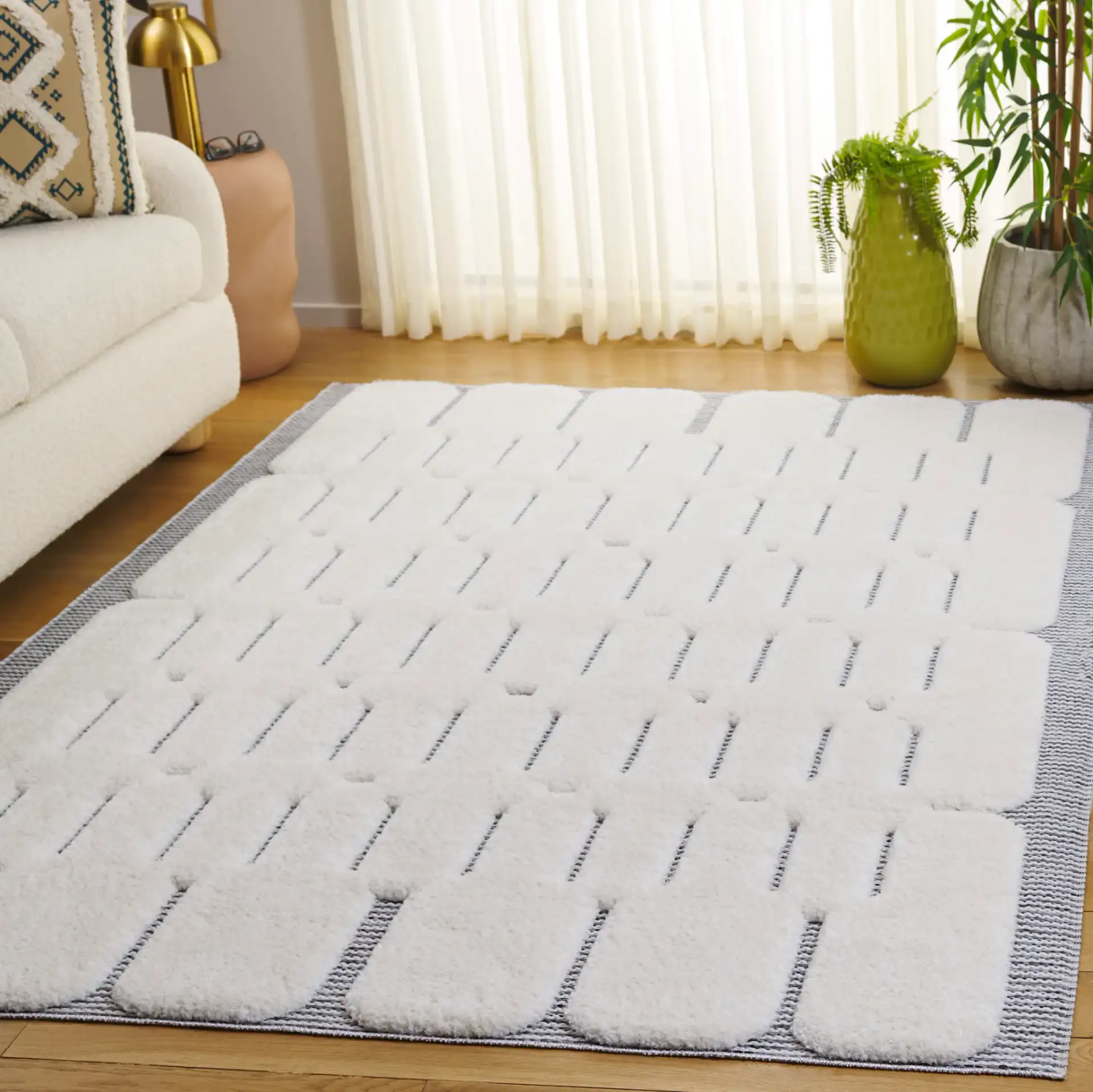 Celebrity Rounded Block Rug in Ivory / Gray in a styled room