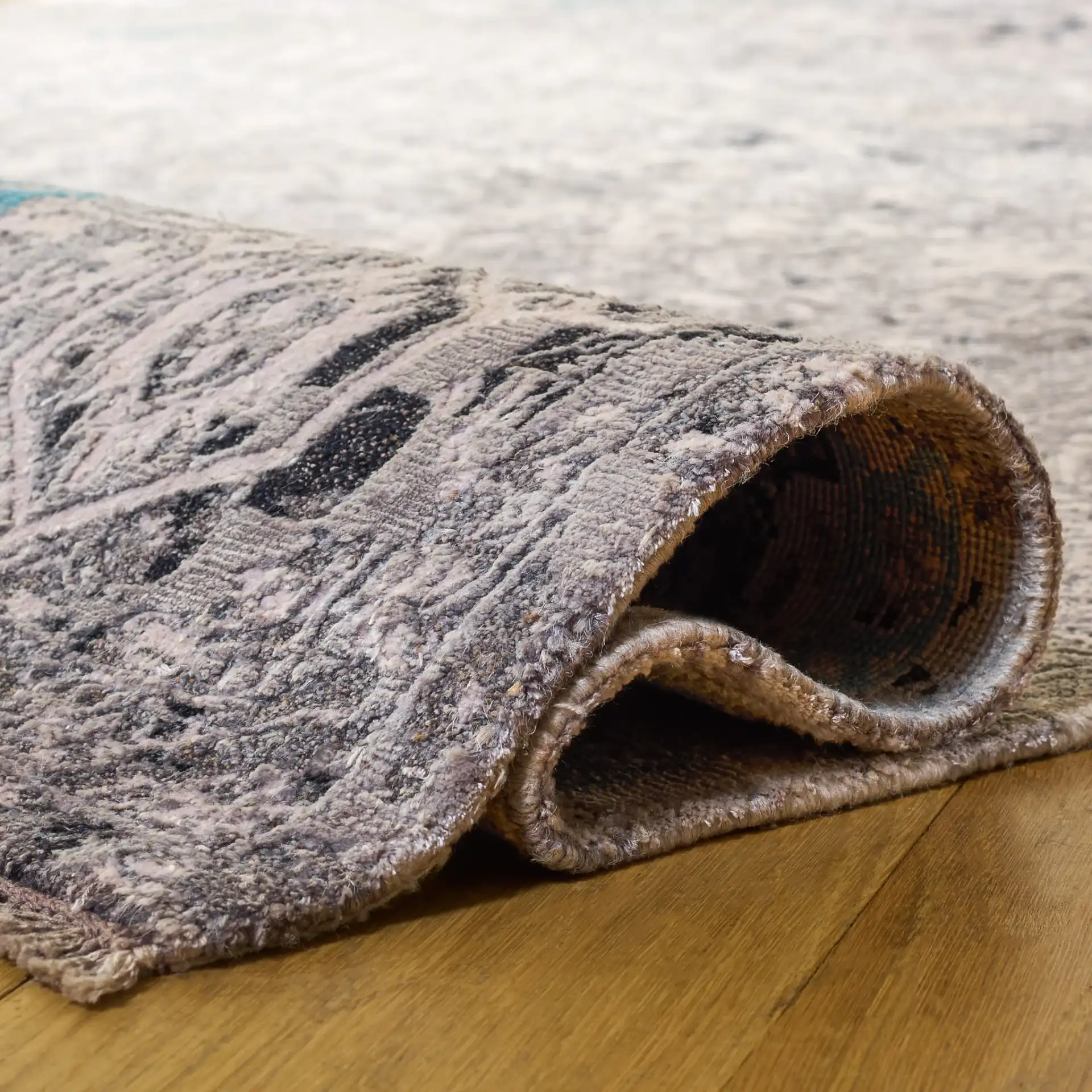 Centennial Distressed Border Hand-Knotted Rug in Light Blue in a styled room