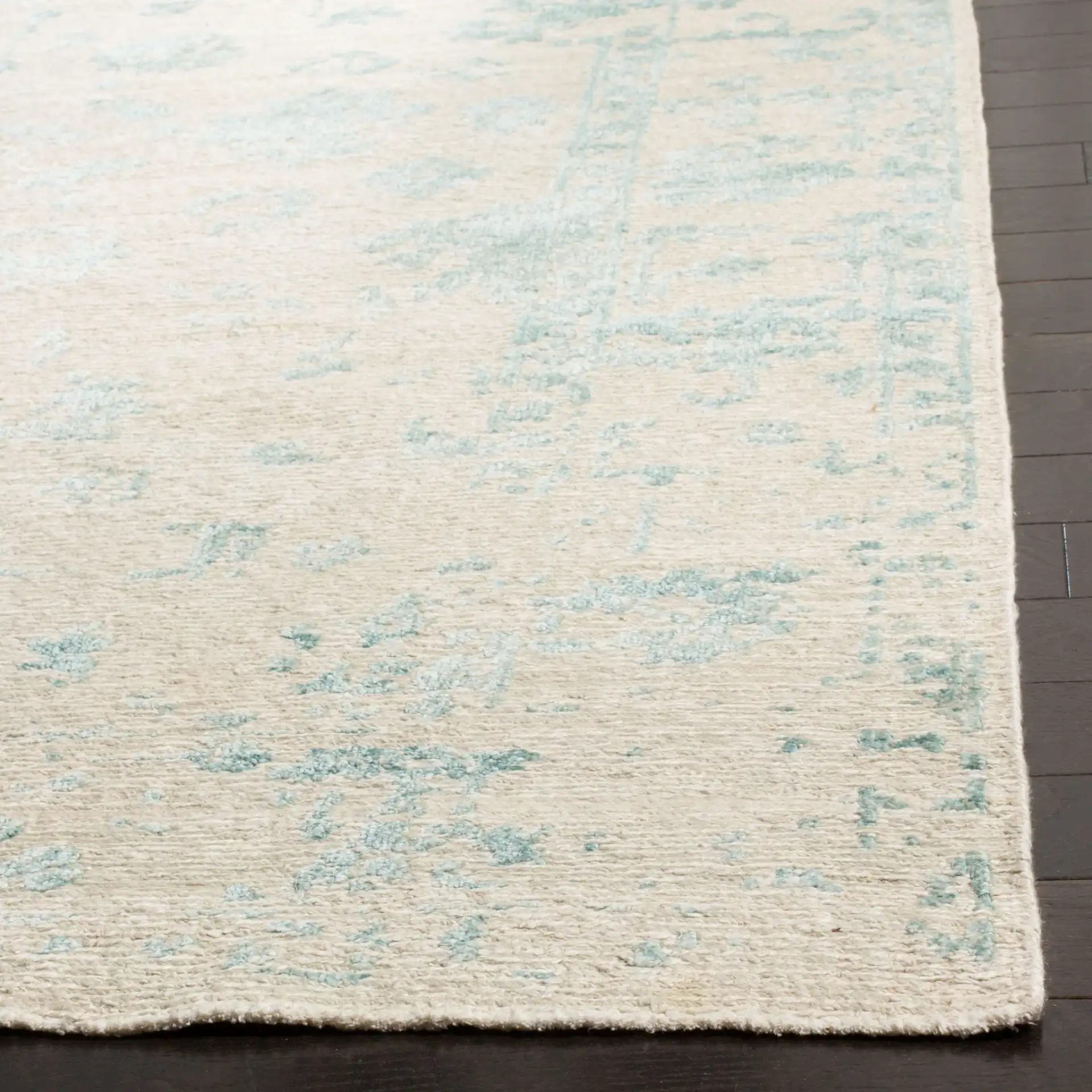 Centennial Distressed Floral Hand-Knotted Rug in Silver / Light Blue in a styled room