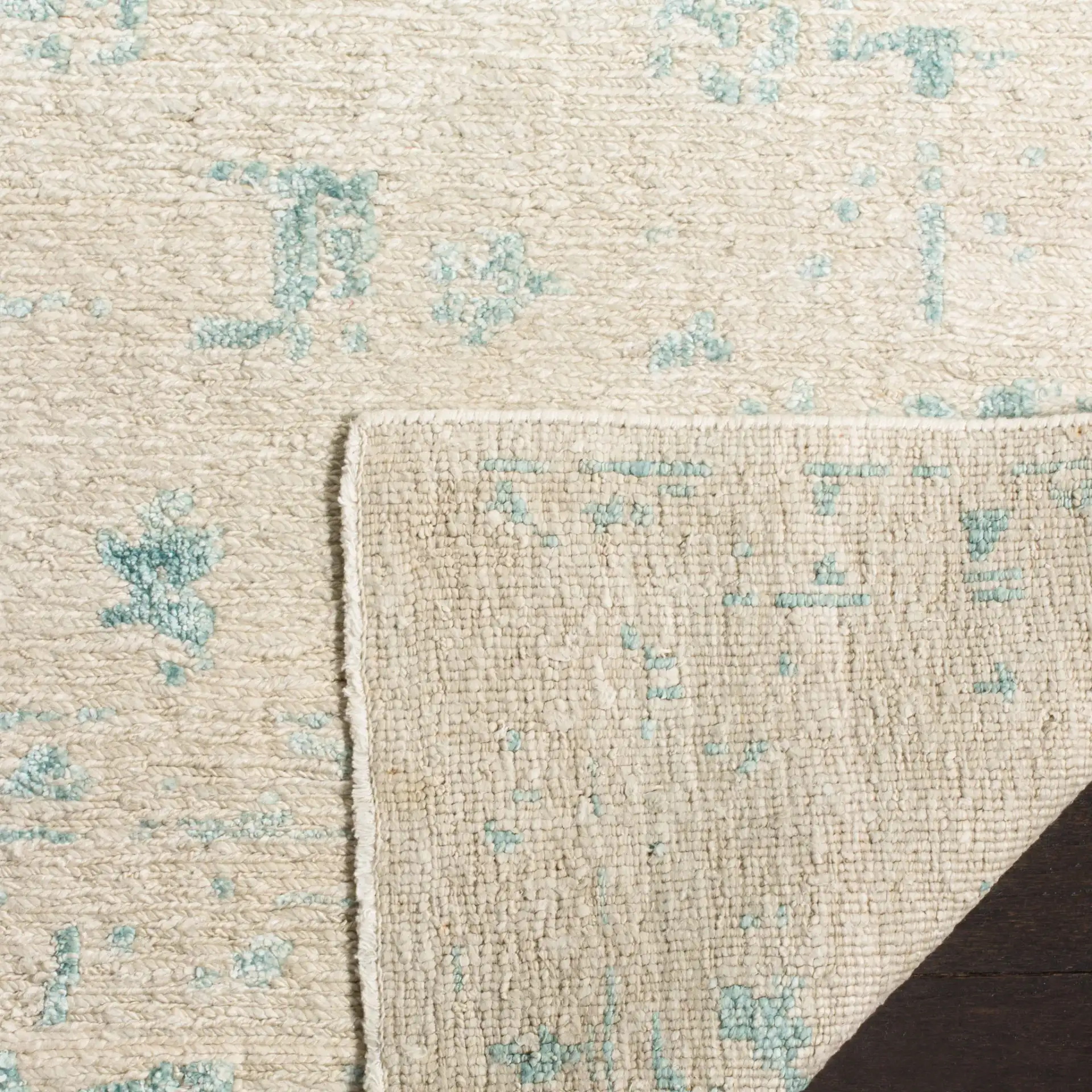 Centennial Distressed Floral Hand-Knotted Rug in Silver / Light Blue in a styled room