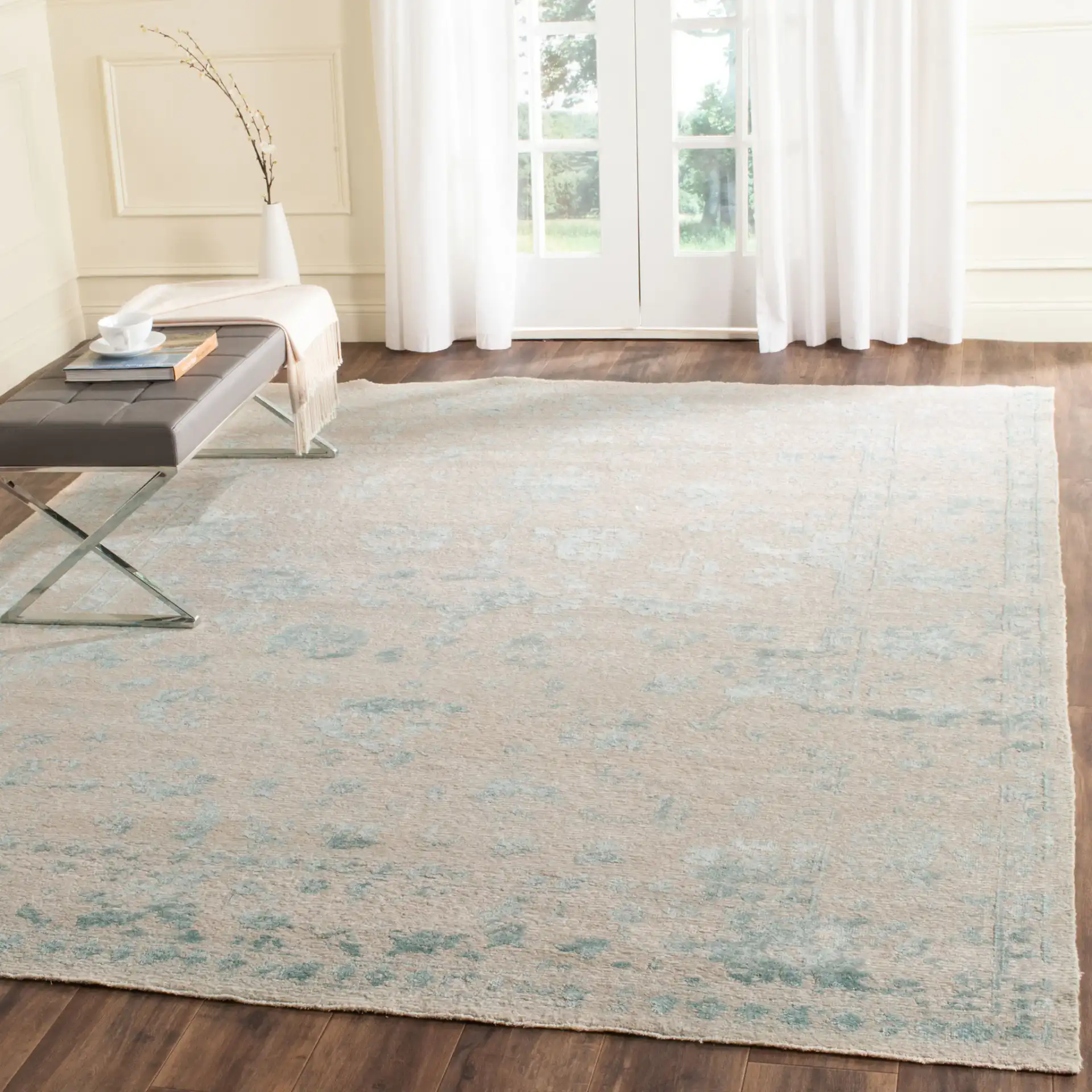 Centennial Distressed Floral Hand-Knotted Rug in Silver / Light Blue in a styled room