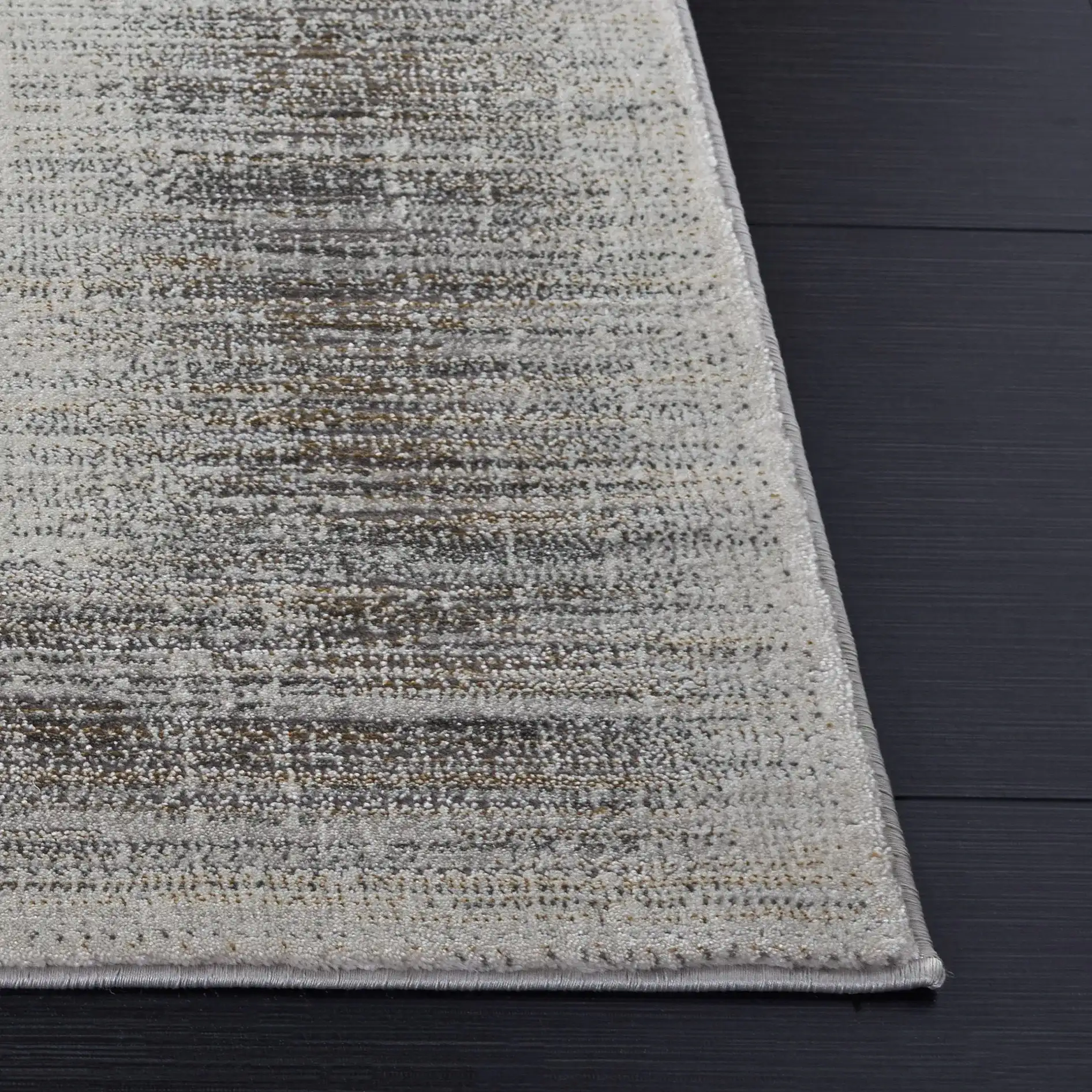 Craft Linear Abstract Border Rug in Gray / Gold in a styled room