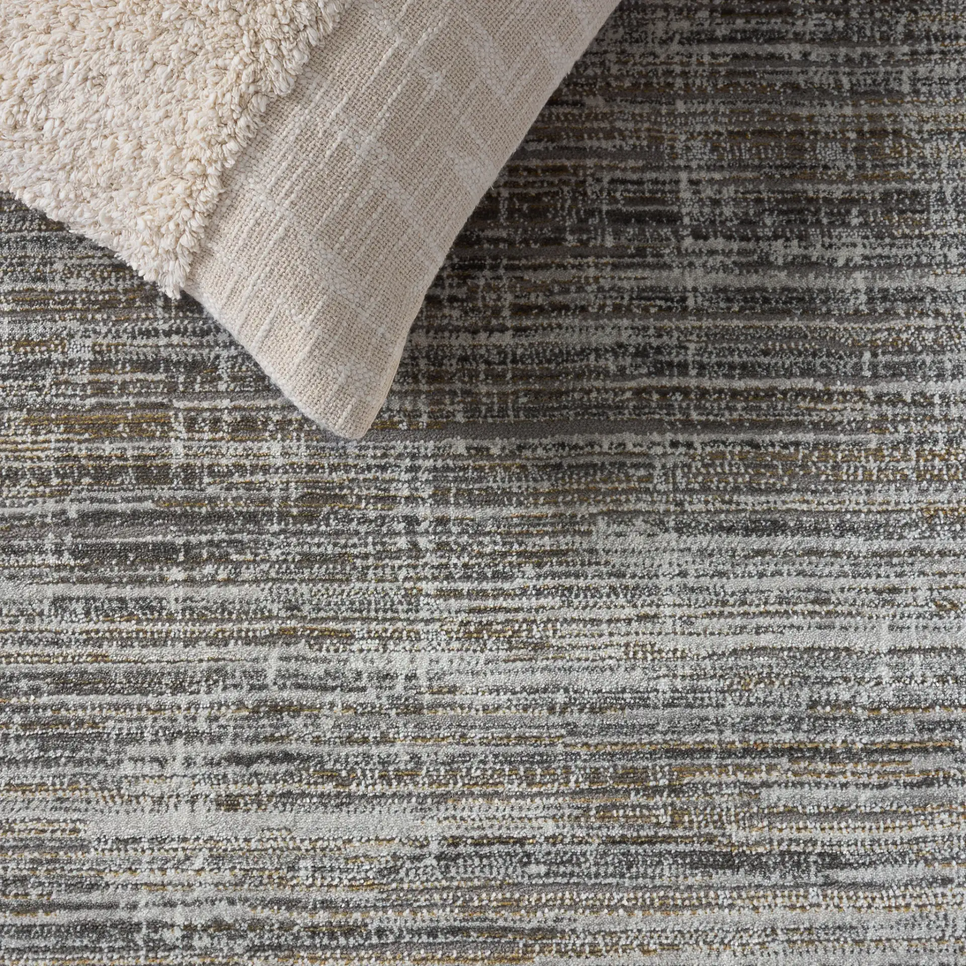 Craft Linear Abstract Border Rug in Gray / Gold in a styled room