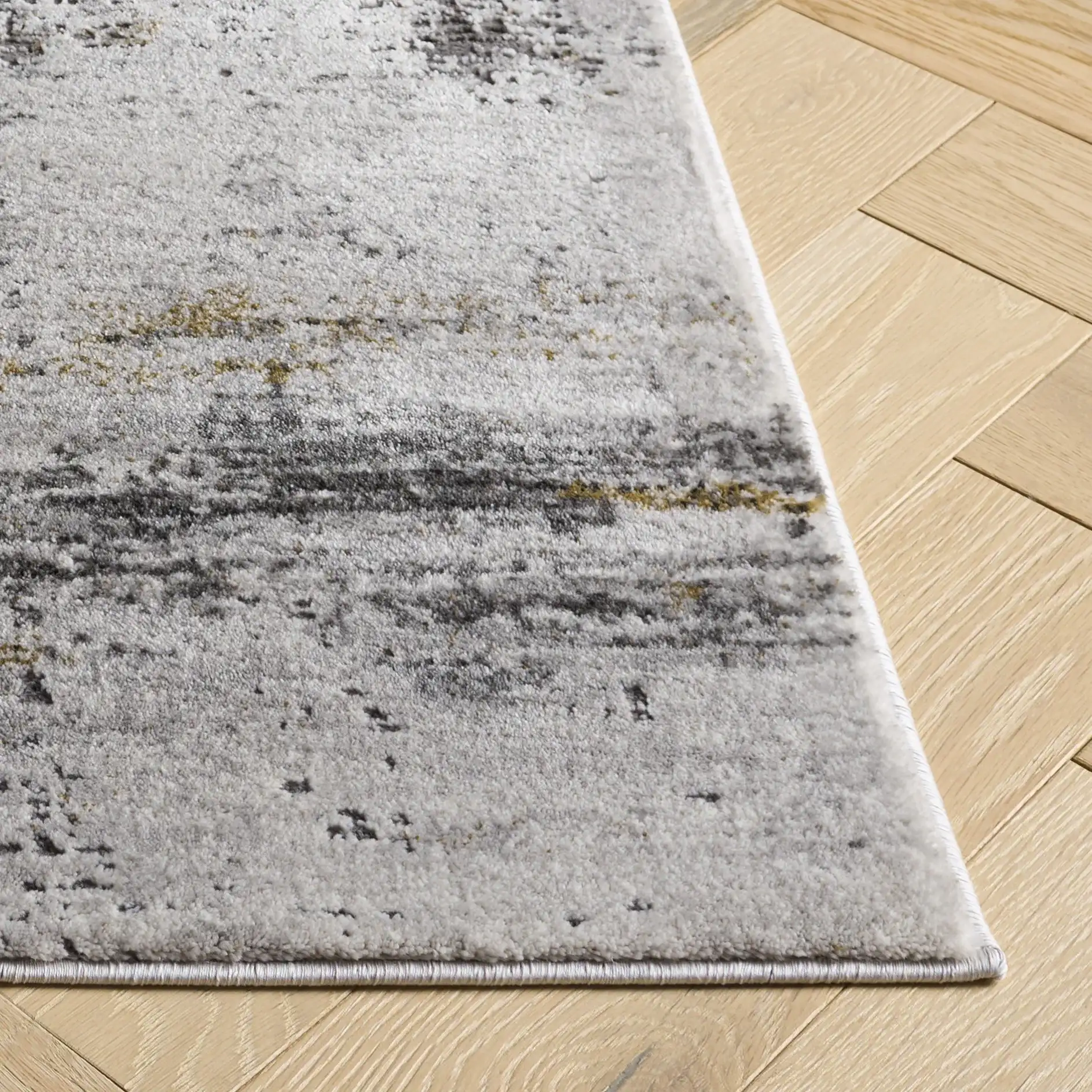 Craft Modern Abstract Rug in Gray / Gold in a styled room