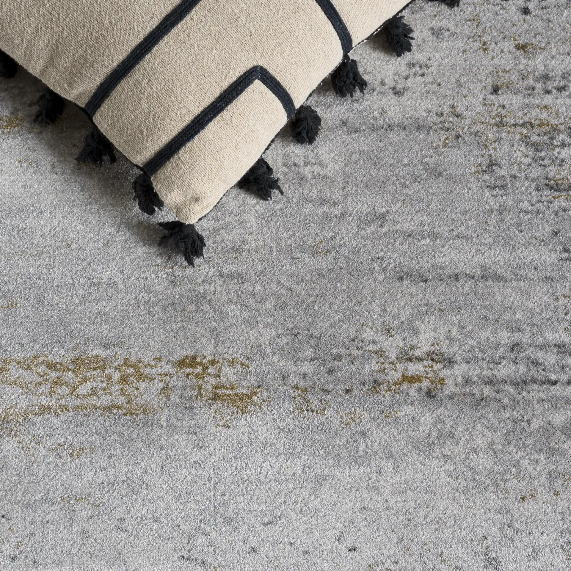 Craft Modern Abstract Rug in Gray / Gold in a styled room