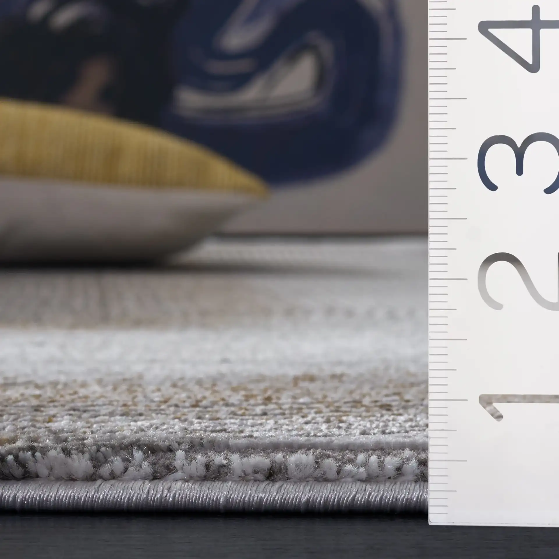 Craft Linear Arch Rug in Gray / Gold in a styled room