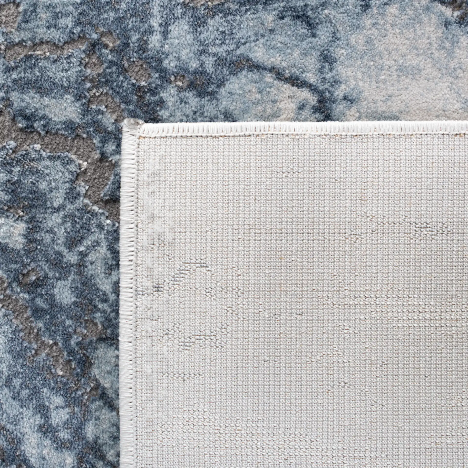 Craft Marbled Stone Rug in Blue / Gray in a styled room