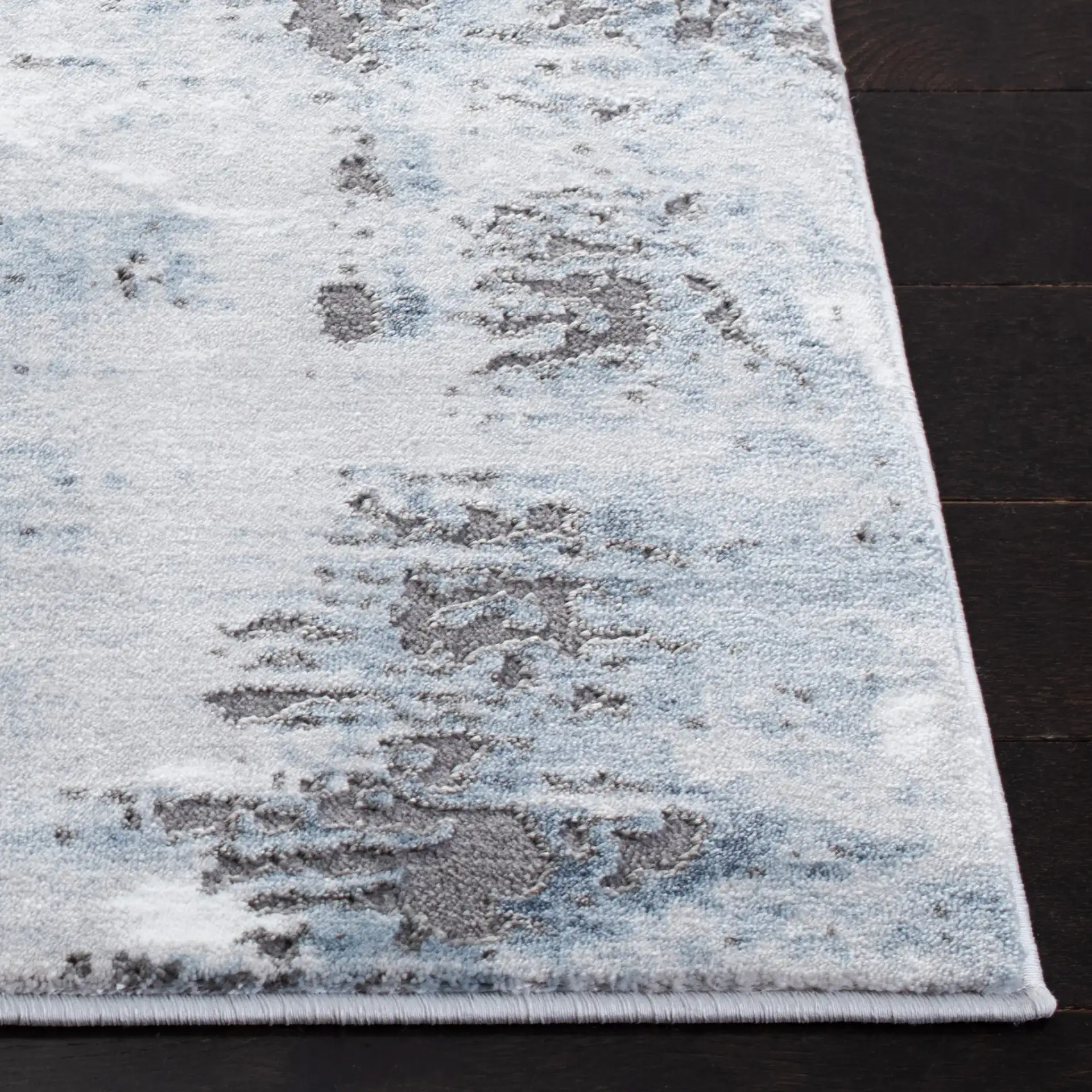 Craft Abstract Rug in Blue / Gray in a styled room