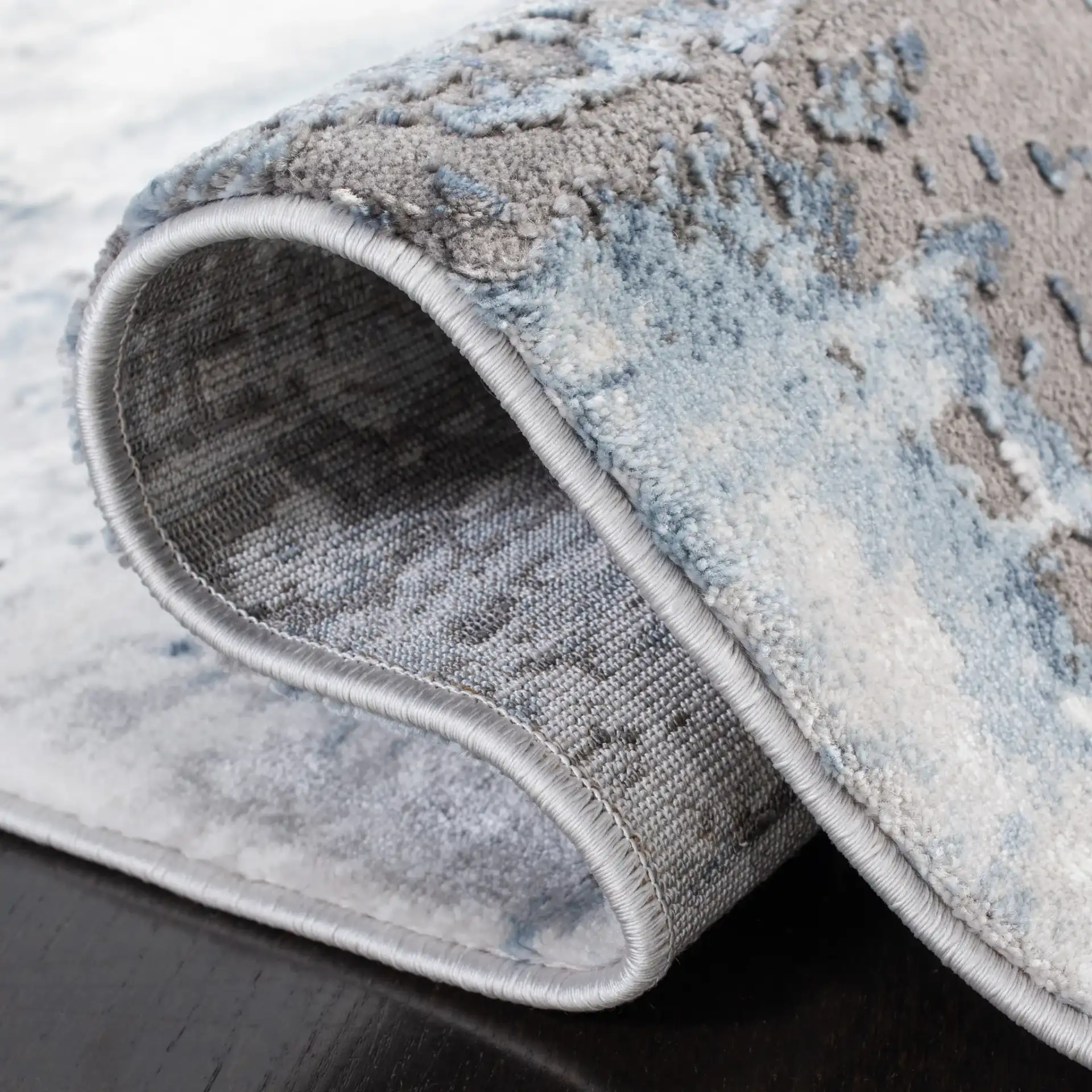 Craft Abstract Rug in Blue / Gray in a styled room