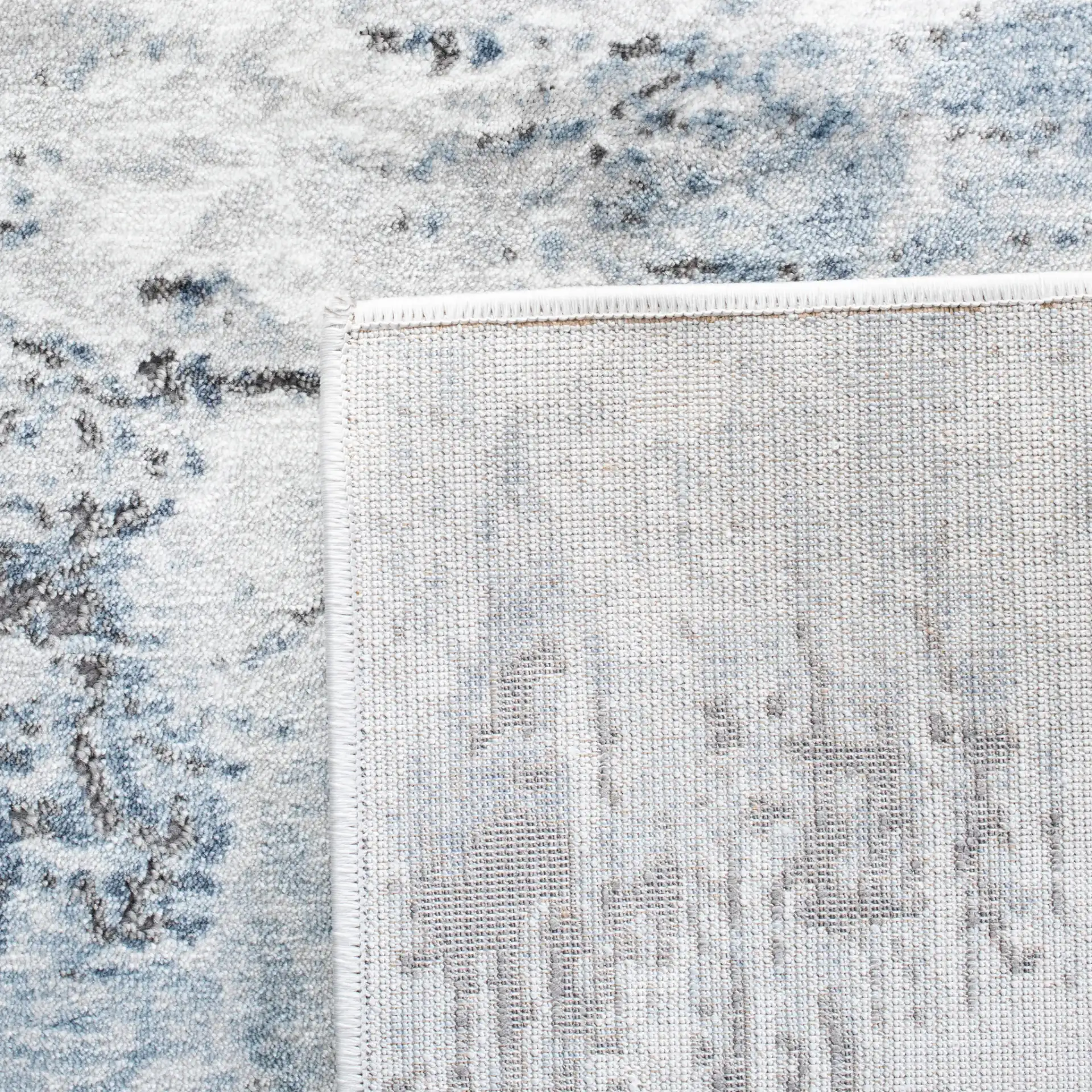 Craft Abstract Rug in Blue / Gray in a styled room