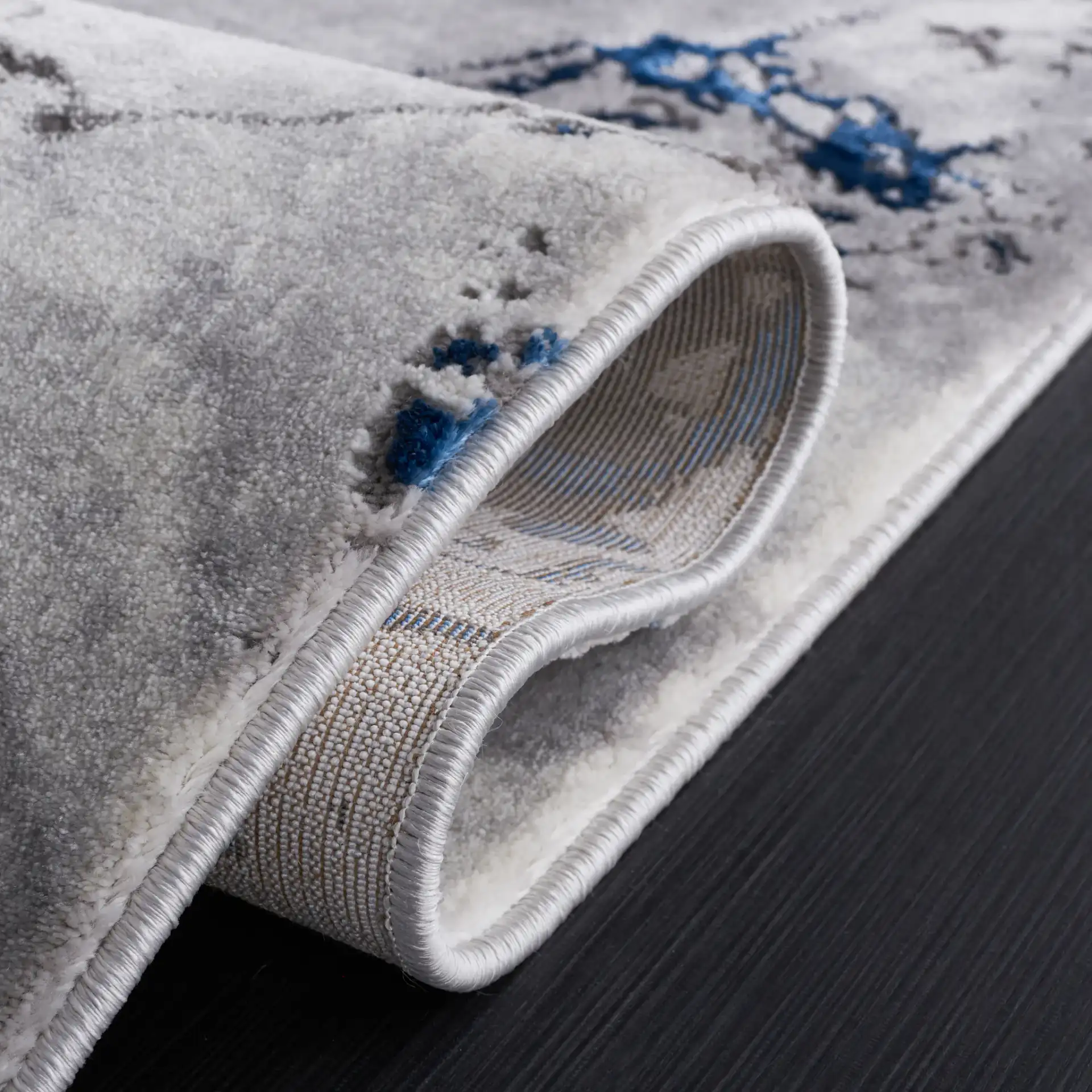 Craft Abstract Marble Rug in Gray / Blue in a styled room